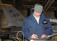 Senior Airman Samuel Strong, 8th Aircraft Maintenance Squadron crew chief, Kunsan Air Base, Republic of Korea, runs post-mission checklists following a mission during Red Flag-Alaska on Eielson Air Force Base, Alaska, Oct. 5, 2012. Strong is one of more than 150 personnel sent to Alaska from Kunsan to participate in Distant Frontier and Red Flag, exercises which tested the combat effectiveness of aircraft, equipment and personnel through various simulated scenarios. (U.S. Air Force photo/Staff Sgt. Jonathan Fowler)