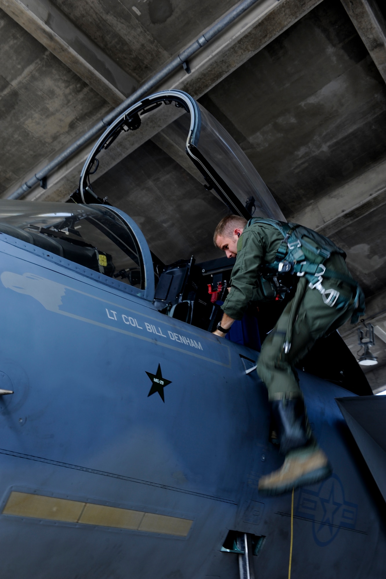 U.S. Air Force Capt. Dustin Johnson, 67th Fighter Squadron F-15 Eagle pilot, prepares to enter the cockpit of an F-15 Eagle on Kadena Air Base, Japan, Oct. 10, 2012. The Eagle's air superiority is achieved through a mixture of unprecedented maneuverability, acceleration, range, weapons and avionics. (U.S. Air Force photo/Airman 1st Class Justin Veazie)