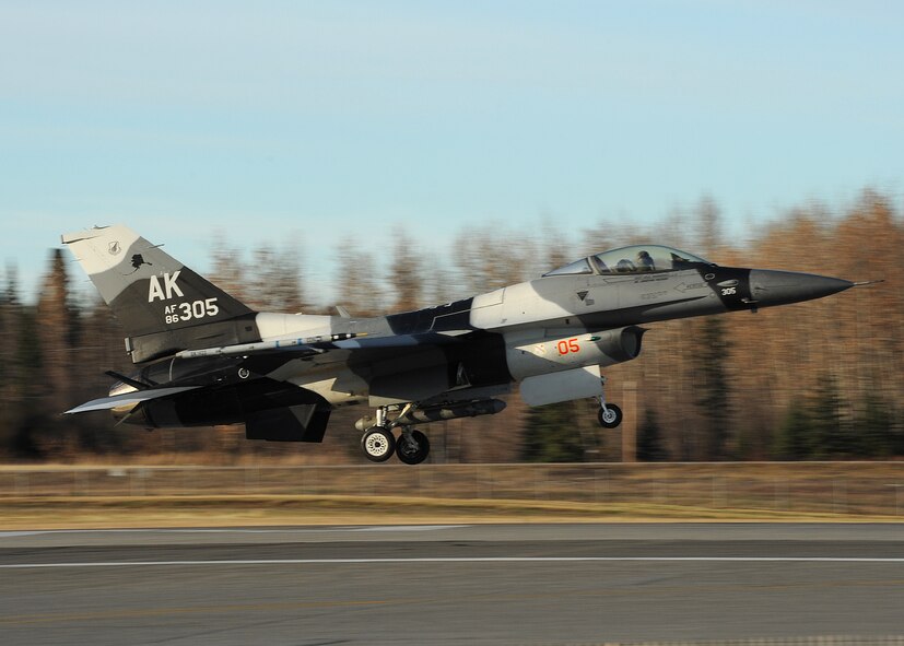 An F-16 Fighting Falcon from the 18th Aggressor Squadron lands after a mission during Distant Frontier on Eielson Air Force Base, Alaska, Oct. 3, 2012. The 18th AS’s aircraft acted as the “enemy” during Distant Frontier and Red Flag-Alaska in order to test the combat capabilities of participating units. (U.S. Air Force photo/Staff Sgt. Jonathan Fowler)