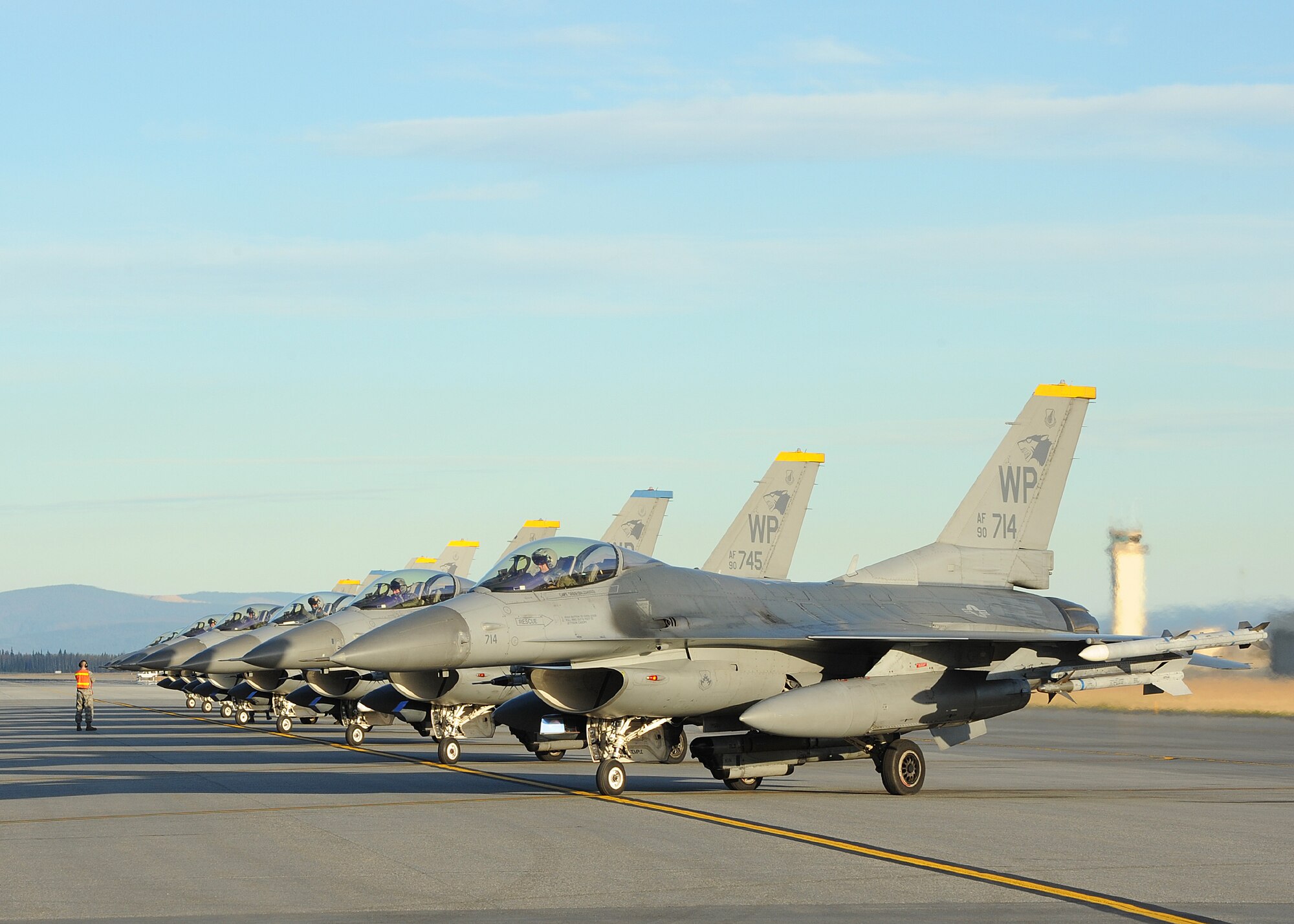 Several F-16 Fighting Falcons with the 35th Fighter Squadron, Kunsan Air Base, Republic of Korea, wait to take off during Distant Frontier on Eielson Air Force Base, Alaska, Oct. 3, 2012. Fourteen aircraft from the 8th FW participated in Distant Frontier and Red Flag-Alaska, two exercises featuring simulated combat scenarios to test the combat and mission capabilities and effectiveness of participating squadrons. (U.S. Air Force photo/Staff Sgt. Jonathan Fowler)