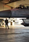 Senior Airman Carey Kimber, 8th Aircraft Maintenance Squadron crew chief, conducts pre-flight preparations with Maj. Daniel Ficklin, 35th Fighter Squadron pilot, during Distant Frontier on Eielson Air Force Base, Alaska, Oct. 3, 2012. Both men, from Kunsan Air Base, Republic of Korea, are participating in Distant Frontier, an exercise designed to prepare participants for Red Flag-Alaska. (U.S. Air Force photo/Staff Sgt. Jonathan Fowler)