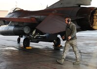 Senior Airman Carey Kimber, 8th Aircraft Maintenance Squadron, Kunsan Air Base, Republic of Korea, does a final inspection of an F-16 Fighting Falcon from the 35th Fighter Squadron at Kunsan before a simulated combat mission during Distant Frontier on Eielson Air Force Base, Alaska, Oct. 3, 2012. Kimber is one of more than 120 maintainers sent to Eielson to participate in Distant Frontier and Red Flag-Alaska. (U.S. Air Force photo/Staff Sgt. Jonathan Fowler)