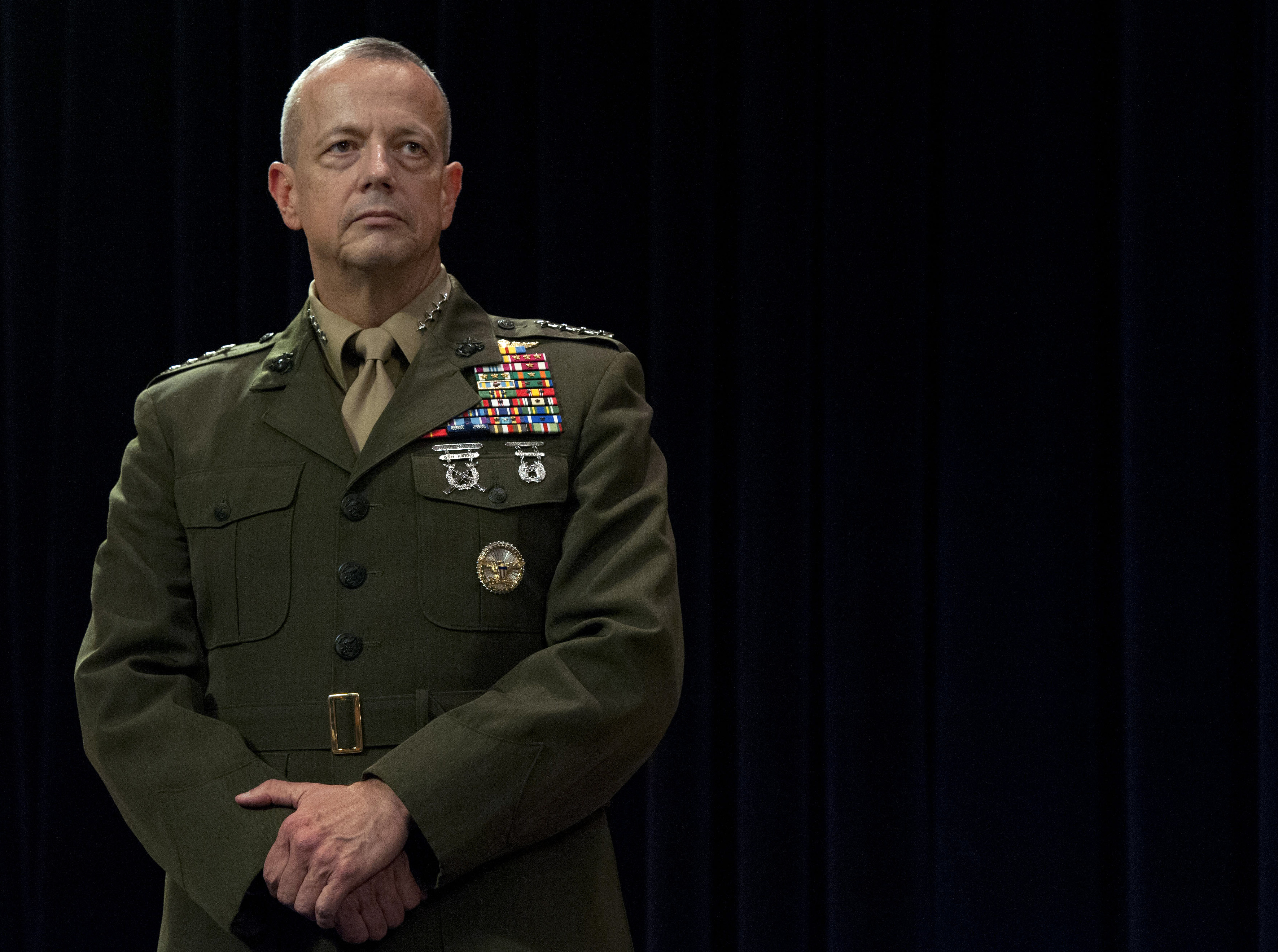 U.S. Marine Corps Gen. John R. Allen stands as U.S. Defense Secretary ...