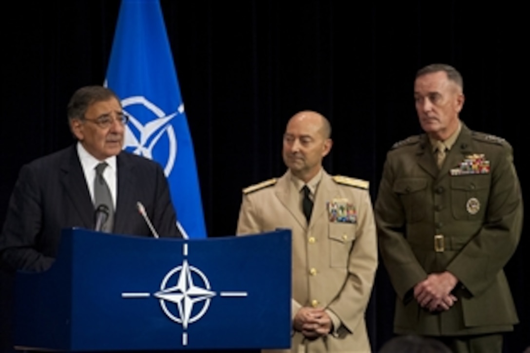 U.S. Defense Secretary Leon E. Panetta announces U.S. command changes in Europe and Afghanistan during a conference of NATO defense ministers in Brussels, Oct. 10, 2012. U.S. Navy Adm. James G. Stavridis, center, commander of U.S. European command and NATO’s supreme allied commander in Europe, and U.S. Marine Corps Gen. Joseph F. Dunford Jr., assistant commandant of the Marine Corps participated in the press conference. 