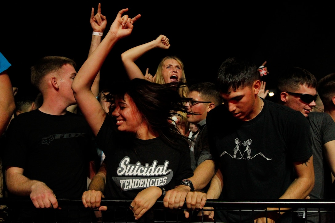 Combat Center fans sing and dance along with Hinder Sept. 29, 2012 at the Sounds of Freedom 2012 concert at Lance Cpl. Torrey L. Gray Field. Hundreds of patrons came out to cheer on the bands