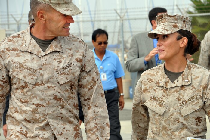 Promoted two days after this photo was taken, Captain Kanella Hatchett of the Marine Corps Tactical Systems Support Activity (MCTSSA) talks with Brigadier General Vincent Coglianese, Commanding General, Marine Corps Installations West, during the General’s tour of MCTSSA and Amphibious Vehicle Test Branch facilities at Camp Pendleton, Calif., on Oct. 3. 