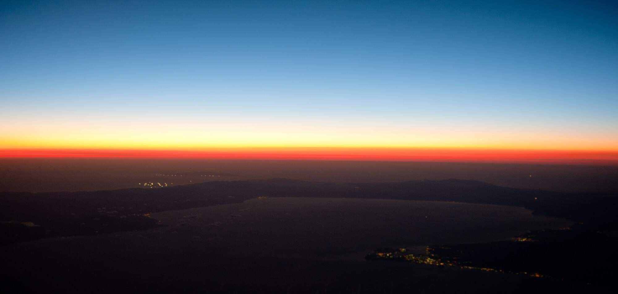 OVER JAPAN -- The sun sets over Japan Oct. 7, 2012, at the end of a NASA research flight. The NASA researchers flew over Japan for three days, flying for more than 18 hours. (U.S. Air Force photo by Airman 1st Class John D. Partlow)