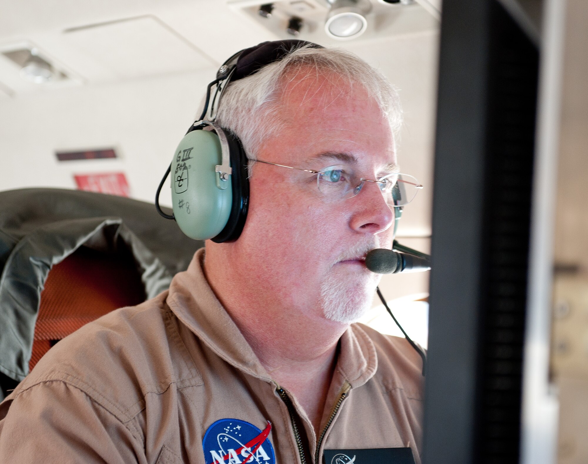 OVER JAPAN -- Timothy Miller, NASA cognizant engineer, initializes a radar system on a Gulfstream III Oct. 7, 2012. The G-III’s NASA crew flew around various parts of Japan to acquire radar data for geographic measurements. (U.S. Air Force photo by Airman 1st Class John D. Partlow)