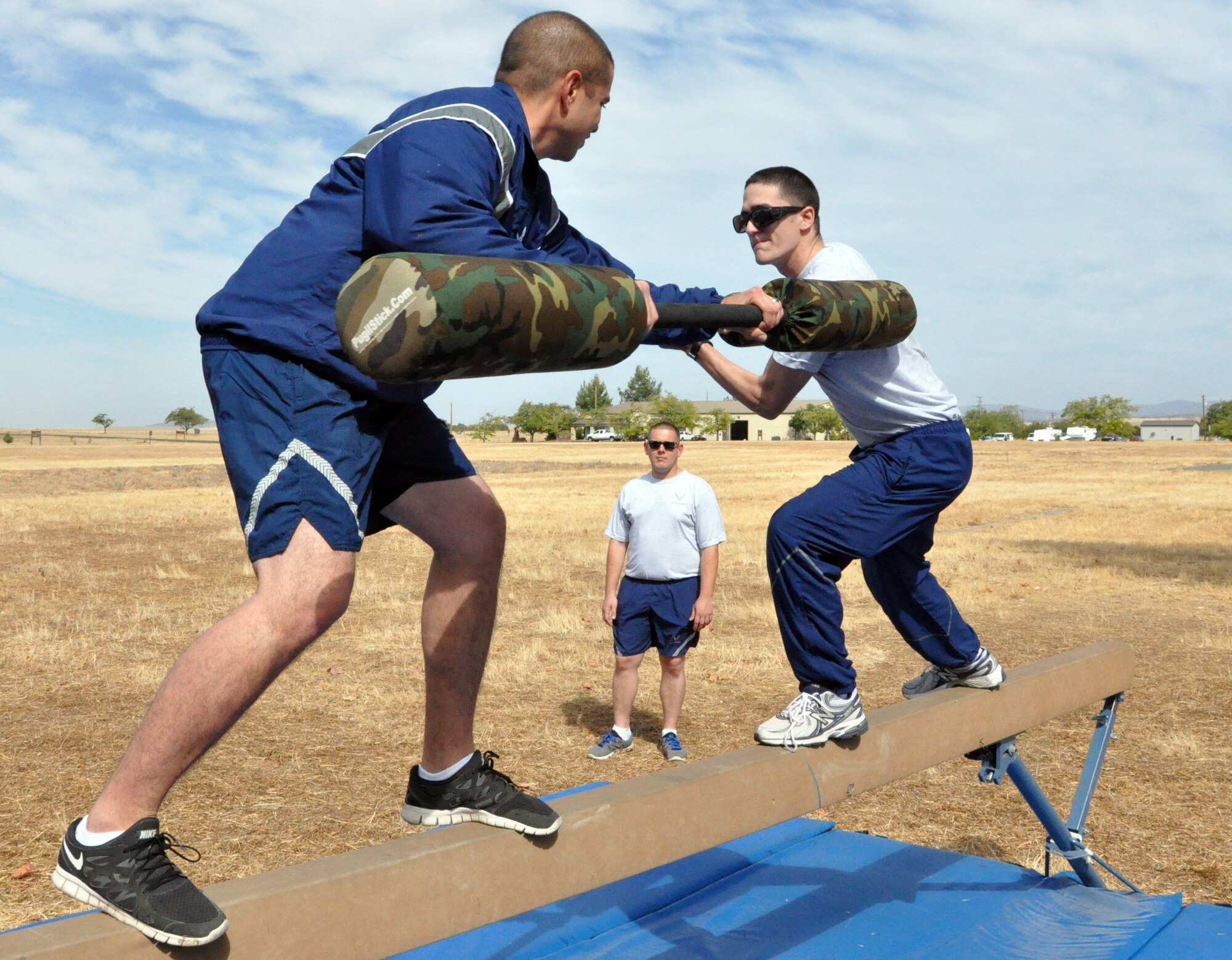 Senior Airman Adam Bright (left), 9th Communications Squadron, and Senior Airman Joshua Craig, 9th Civil Engineer Squadron, face off in the jousting competition portion of Beale Air Force Base's annual sports day Oct. 5. (U.S. Air Force photo by Tech. Sgt. Eric Petosky/Released) 