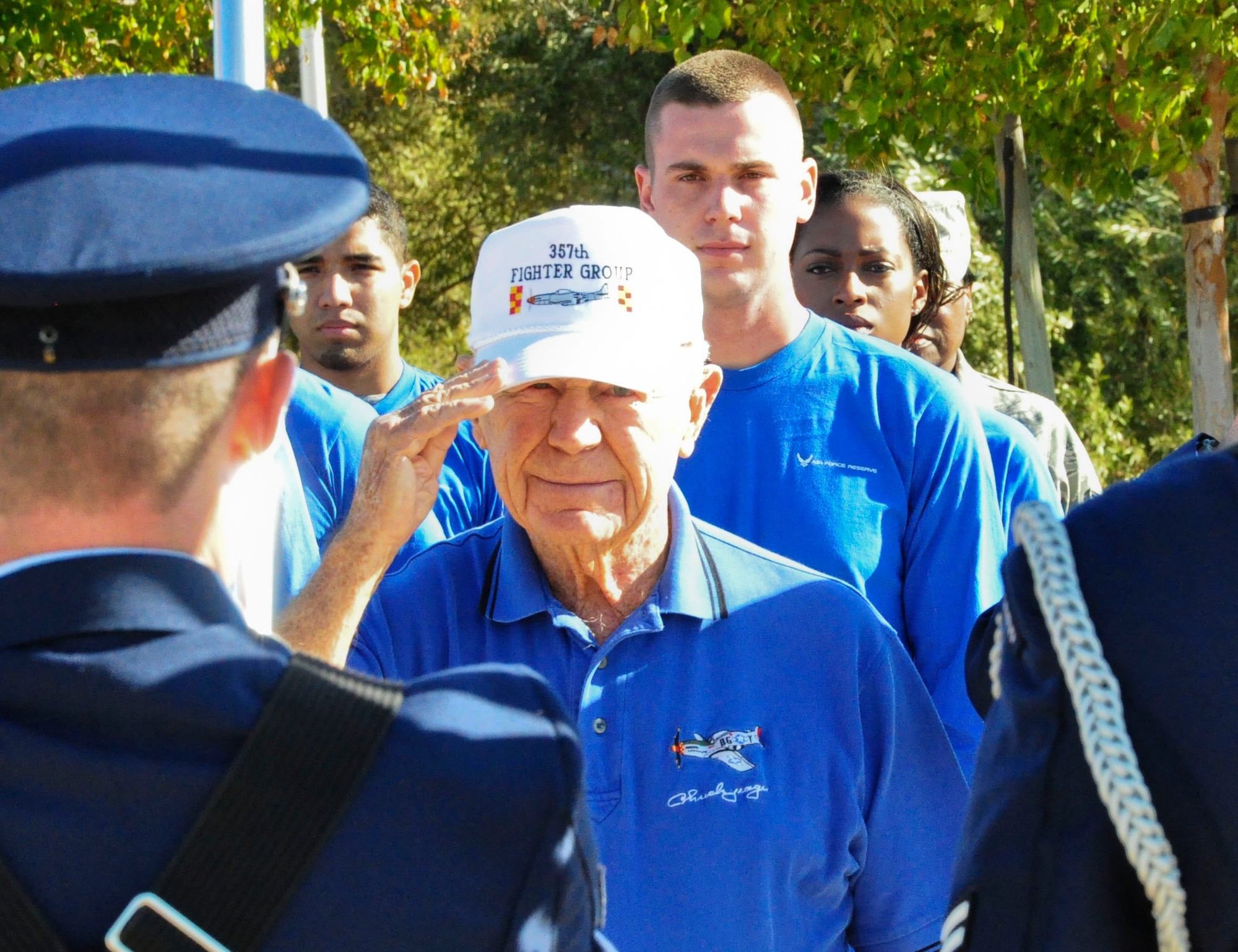 Maj. Gen. (ret) Charles "Chuck" Yeager salutes the flag during the national anthem before administering the oath of enlistment to future members of the Air Force Reserve Oct. 8 at Beale Air Force Base, Calif. Yeager was the first man to break the sound barrier in 1947. After administering the oath of enlistment he offered advice to the future Airmen as they begin or continue their careers as Reservists. (U.S. Air Force photo by Tech. Sgt. Eric Petosky/Released)