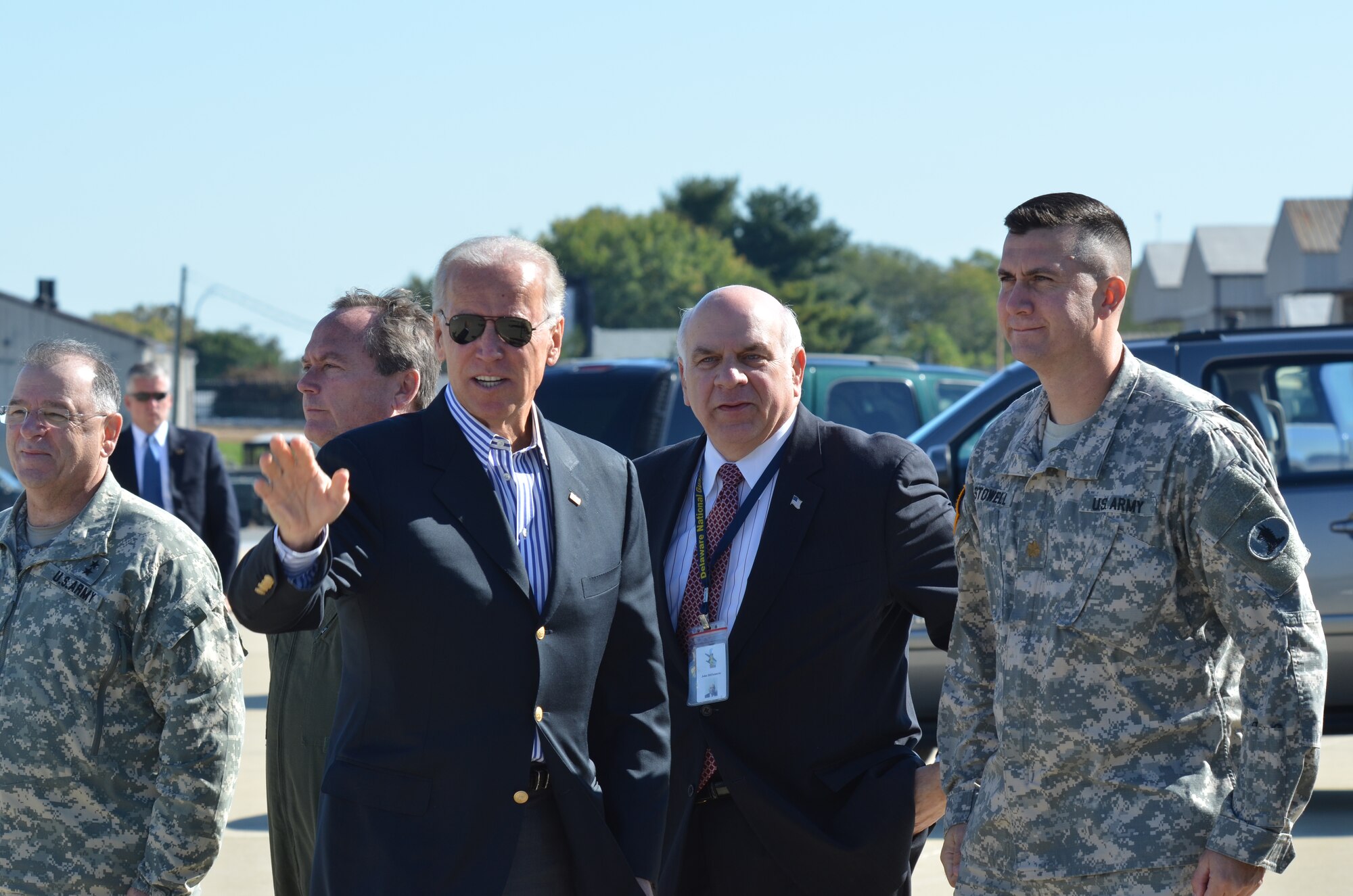 Vice President Joe Biden waves to members of the press after he is greeted by Maj. Gen. Frank D. Vavala, The Adjutant General, Delaware National Guard, Col. Mike Feeley, commander, 166th Airlift Wing, Delaware Air National Guard, Mr. John DiEleuterio, Director of Inter-Governmental Relations, Delaware National Guard, and Maj. Jeff Stowell, executive officer to the Adjutant General, Delaware National Guard, as he arrives at the New Castle Air National Guard Base, Delaware on October 11, 2012 to board Air Force Two for a flight to Lexington Blue Grass Airport, in Lexington, Ky., for tonight’s vice presidential debate in nearby Danville, Ky. (U.S. Air Force photo/Staff Sgt. Nathan Bright)