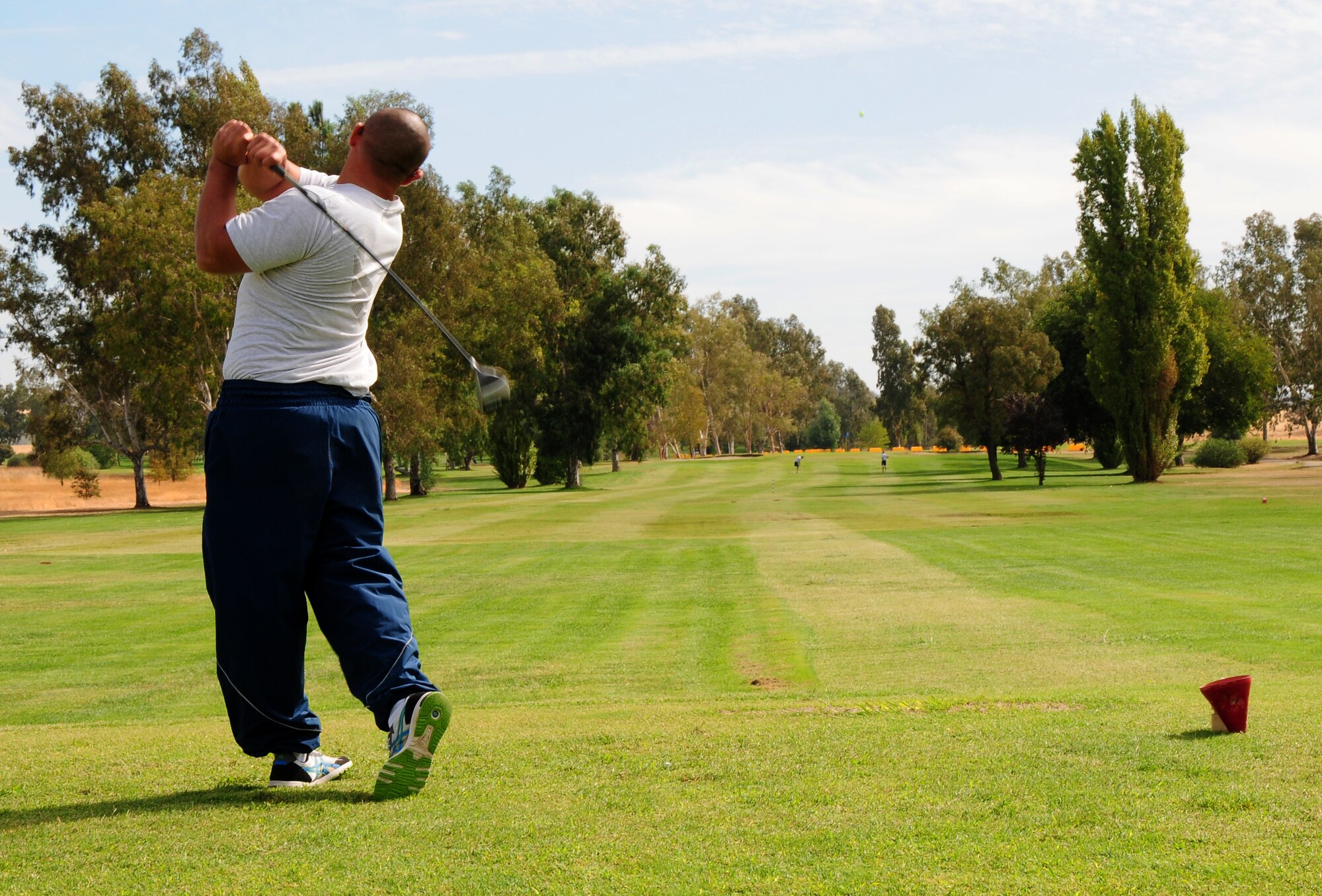 A member of Team Beale participates in the speed golf portion of the base's annual sports day at Coyote Run Golf course, Beale Air Force Base Calif. Oct. 5, 2012. Speed golf participants were scored on their number of strokes and time taken to complete nine holes. (U.S. Air Force photo by Senior Airman Allen Pollard)