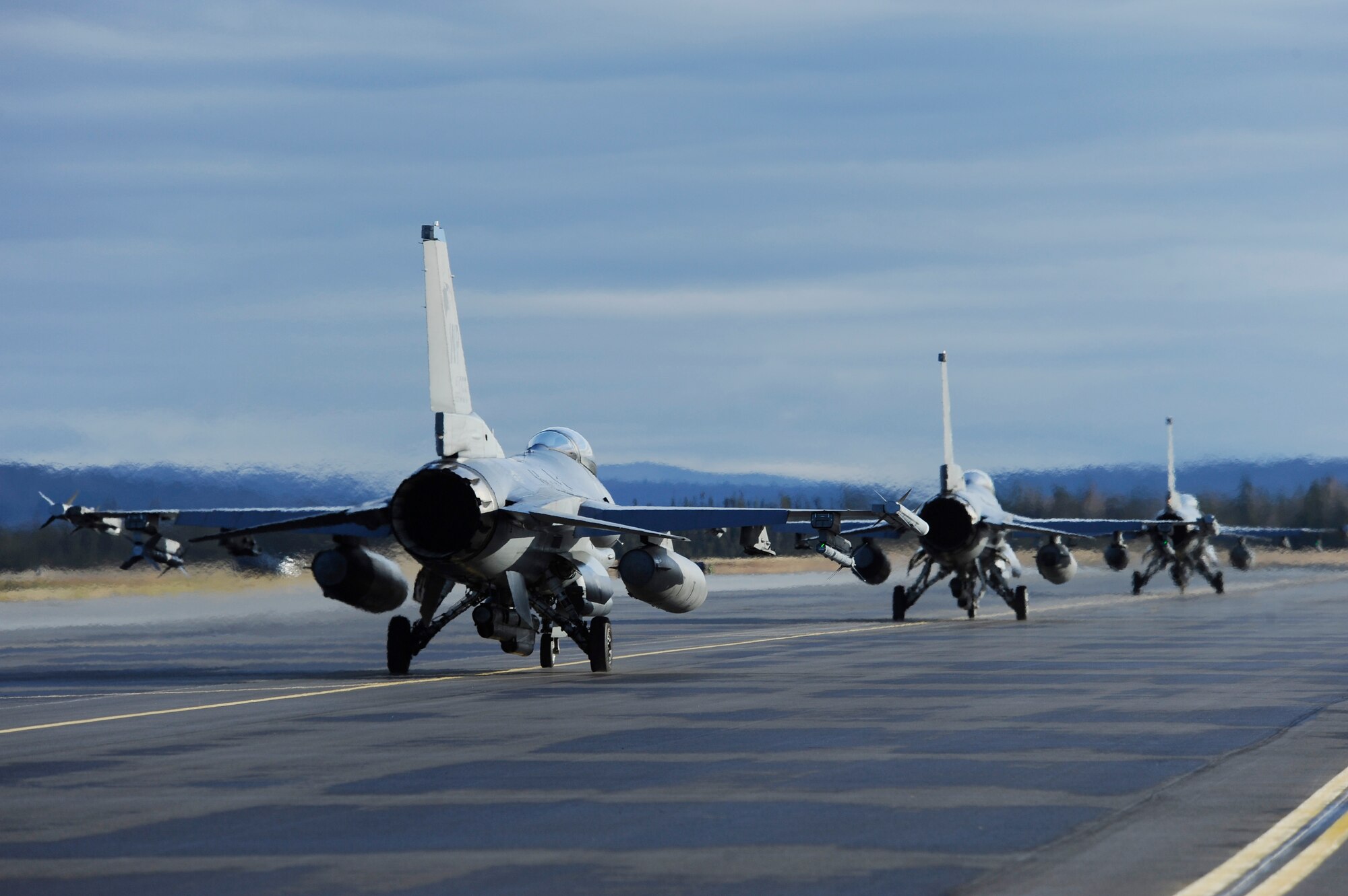F-16 Fighting Falcons assigned to the 35th Fighter Squadron, Kunsan Air Base, Korea, taxi down the runway  during RED FLAG-Alaska 13-1 Oct. 9, 2012, Eielson Air Force Base, Alaska. RF-A, a two-week-long exercise, focuses on aerial combat training for U.S. and allied forces and is conducted within the Joint Pacific Alaska Range Complex, a 67,000 square-mile training range. (U.S. Air Force photo/Staff Sgt. Jim Araos)