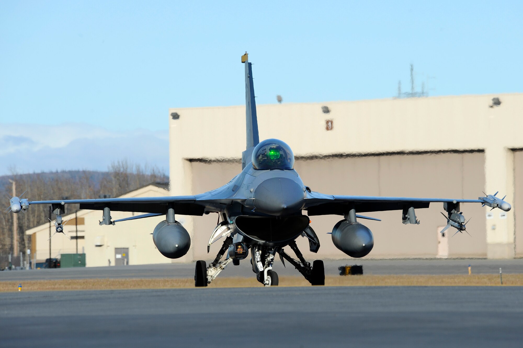 An F-16 Fighting Falcon assigned to the 35th Fighter Squadron, Kunsan Air Base, Korea, taxis down the runway  during RED FLAG-Alaska 13-1 Oct. 9, 2012, Eielson Air Force Base, Alaska. On average, more than 1,000 people and up to 60 aircraft deploy to Eielson for RF-A exercises. (U.S. Air Force photo/Staff Sgt. Jim Araos)