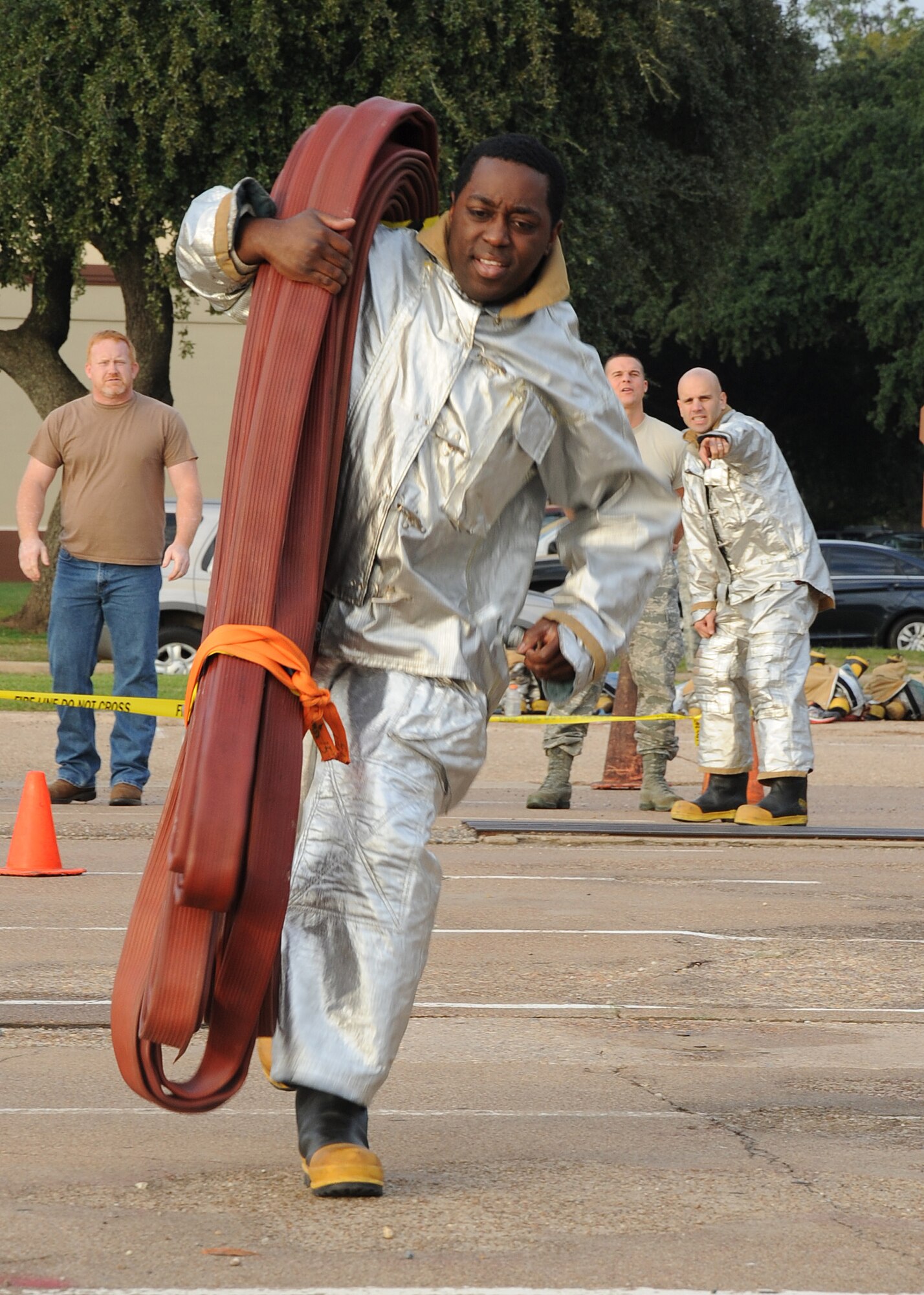 Staff Sgt. Christopher Hearst, 2nd Medical Support Squadron medical laboratory technician, performs a hotel pack carry during the 2nd Bomb Wing Annual Fire Muster Challenge on Barksdale Air Force Base, La., Oct. 11. Teams competed in five events for the best overall time. The challenge was held as part of Fire Prevention Week. (U.S. Air Force photo/Senior Airman Sean Martin)(RELEASED)