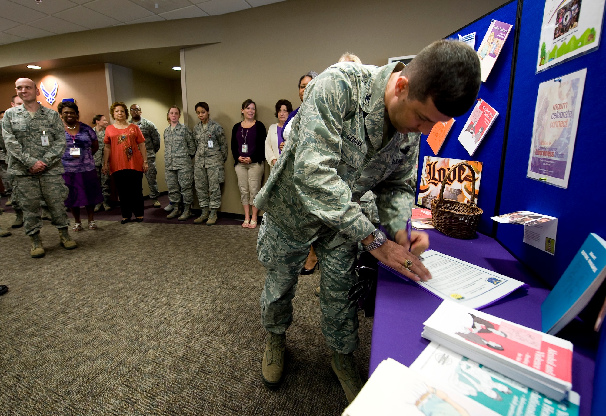Col. Andrew Gebara, 2nd Bomb Wing commander, signs a proclamation declaring October domestic violence awareness month at the 2nd Medical Group on Barksdale Air Force Base, La., Oct. 11. Gebara spoke to members of Team Barksdale about the importance of preventing domestic violence. (U.S. Air Force photo/Staff Sgt. Chad Warren)(RELEASED)