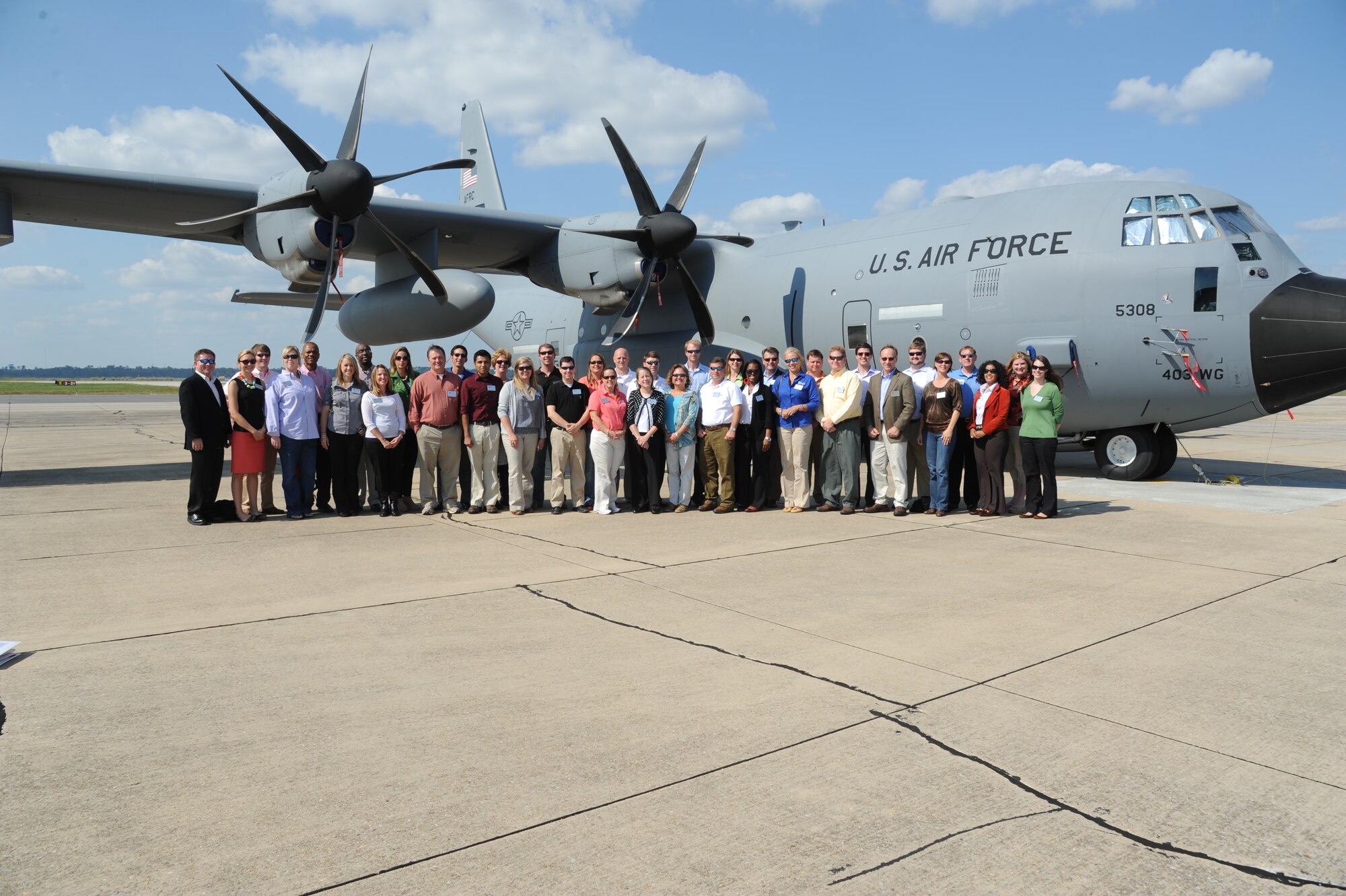Members of Leadership Gulf Coast take a group photo in front of a C-130 J aircraft on the flight line at Keesler Air Force Base, Miss., during a tour of the 403rd Wing Oct. 10, 2012. Leadership Gulf Coast is a Chamber of Commerce program designed to prepare the area’s current and potential leaders for the future. The goal is to create a communication network between present and emerging leaders dedicated to the improvement of the Mississippi Gulf Coast by attending a monthly session focused on industry.  The focus of October’s program is the military’s presence on the coast. The group also ate lunch at the Live Oak Dining Facility, received a wing mission briefing and did a windshield tour of the base.  (U.S. Air Force photo by Kemberly Groue)