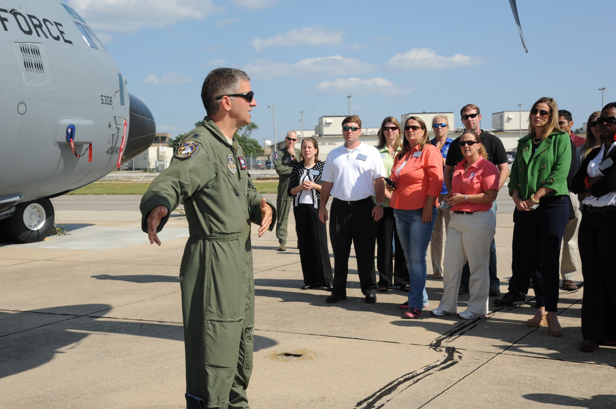 Lt. Col. Jeffrey Ragusa, 403rd Wing, briefs members of Leadership Gulf Coast on the duty of a Hurricane Hunter and the process of flying into a hurricane for observations during a tour Oct. 10, 2012, on the flight line at Keesler Air Force Base, Miss.  Leadership Gulf Coast is a Chamber of Commerce program designed to prepare the area’s current and potential leaders for the future. The goal is to create a communication network between present and emerging leaders dedicated to the improvement of the Mississippi Gulf Coast by attending a monthly session focused on industry.  The focus of October’s program is the military’s presence on the coast. The group also ate lunch at the Live Oak Dining Facility, received a wing mission briefing and did a windshield tour of the base.  (U.S. Air Force photo by Kemberly Groue)