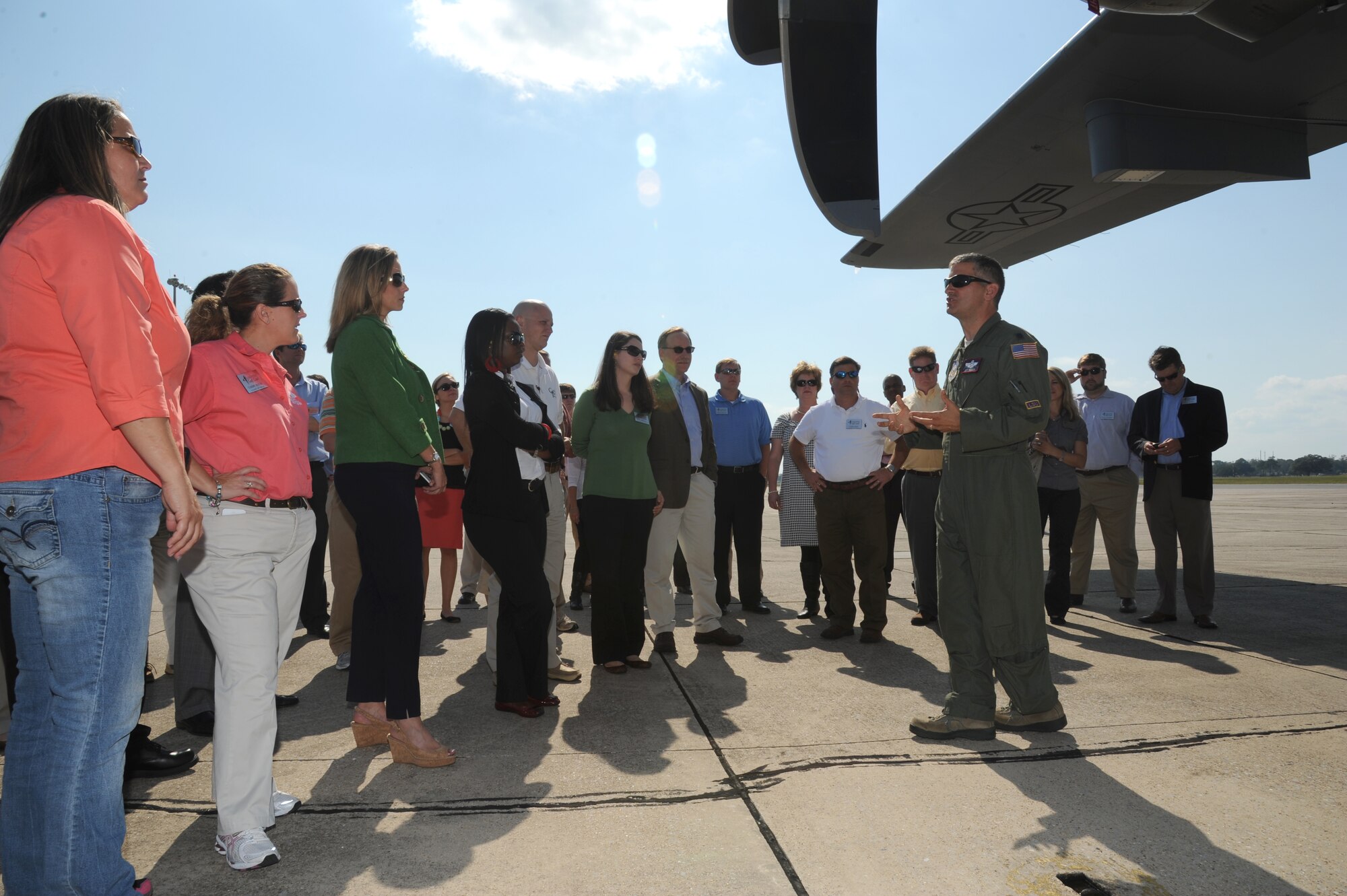 Lt. Col. Jeffrey Ragusa, 403rd Wing, briefs members of Leadership Gulf Coast on the duty of a Hurricane Hunter and the process of flying into a hurricane for observations during a tour Oct. 10, 2012, on the flight line at Keesler Air Force Base, Miss.  Leadership Gulf Coast is a Chamber of Commerce program designed to prepare the area’s current and potential leaders for the future. The goal is to create a communication network between present and emerging leaders dedicated to the improvement of the Mississippi Gulf Coast by attending a monthly session focused on industry.  The focus of October’s program is the military’s presence on the coast. The group also ate lunch at the Live Oak Dining Facility, received a wing mission briefing and did a windshield tour of the base.  (U.S. Air Force photo by Kemberly Groue)