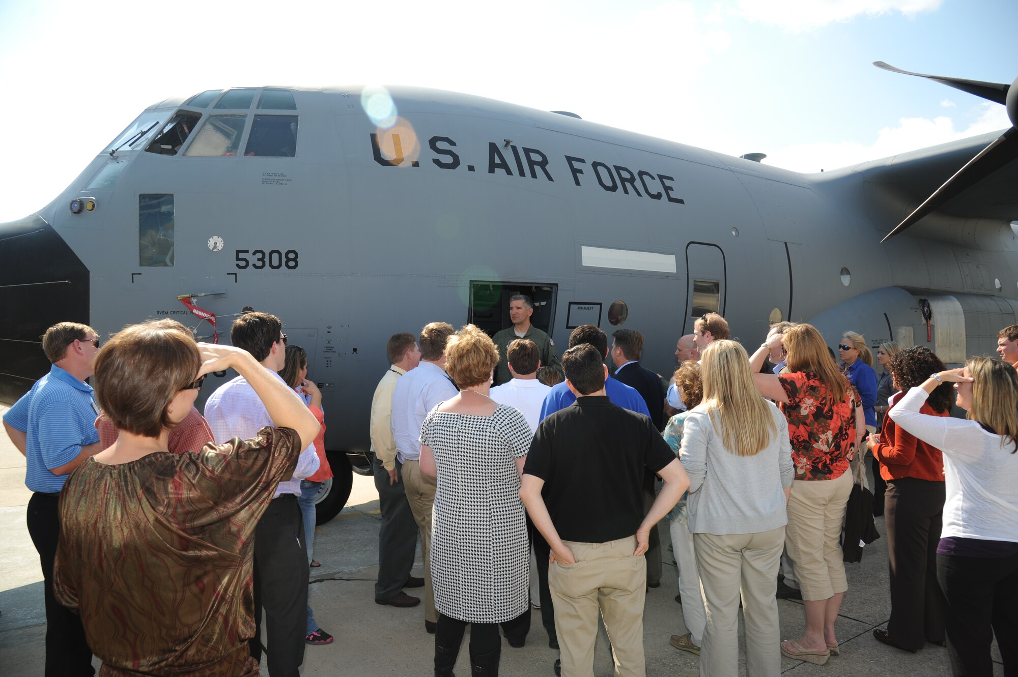 Lt. Col. Jeffrey Ragusa, 403rd Wing, briefs members of Leadership Gulf Coast on the duty of a Hurricane Hunter and the process of flying into a hurricane for observations during a tour Oct. 10, 2012, on the flight line at Keesler Air Force Base, Miss.  Leadership Gulf Coast is a Chamber of Commerce program designed to prepare the area’s current and potential leaders for the future. The goal is to create a communication network between present and emerging leaders dedicated to the improvement of the Mississippi Gulf Coast by attending a monthly session focused on industry.  The focus of October’s program is the military’s presence on the coast. The group also ate lunch at the Live Oak Dining Facility, received a wing mission briefing and did a windshield tour of the base.  (U.S. Air Force photo by Kemberly Groue)