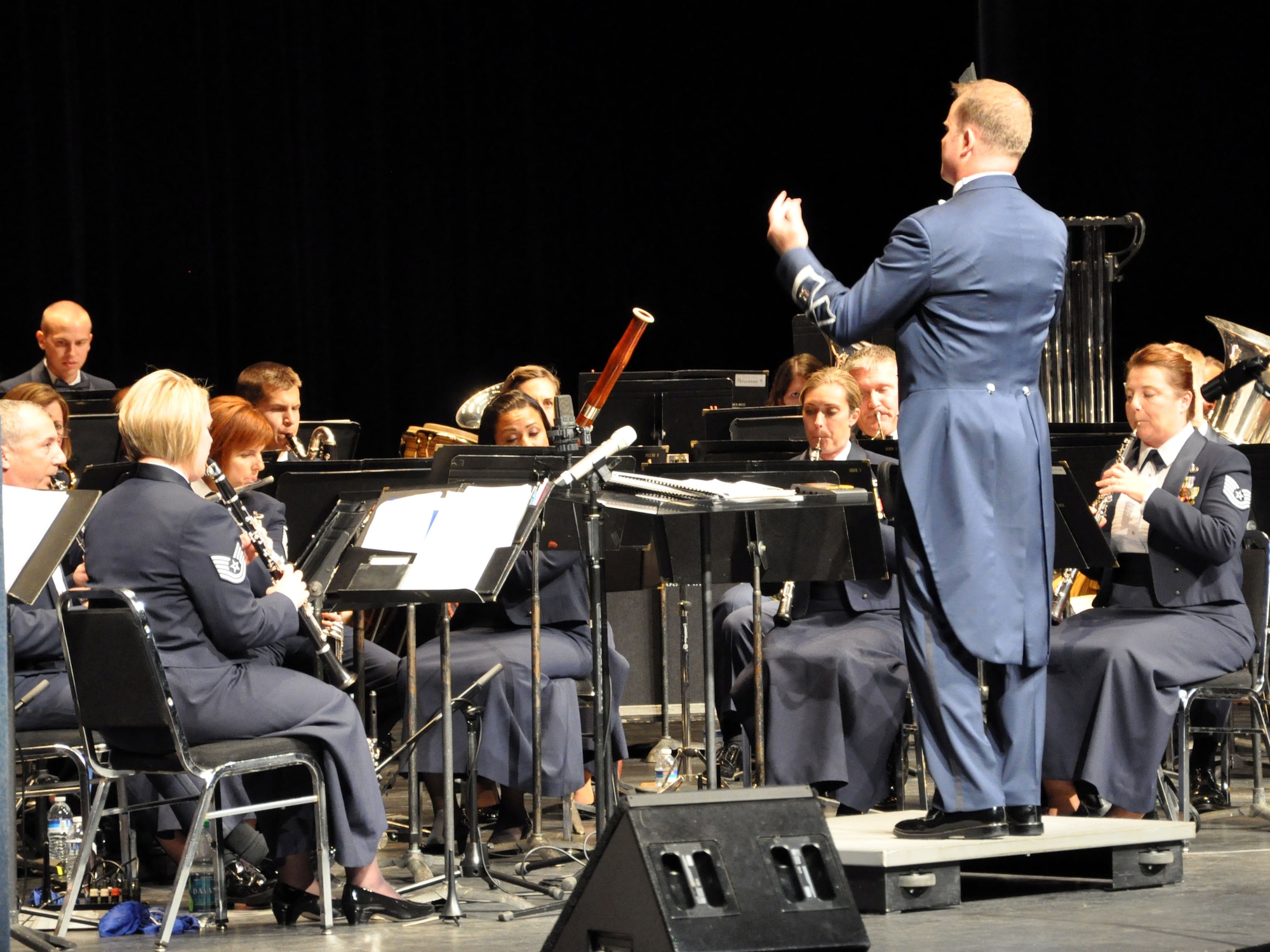 Capt. Jason Plosch, Air Force Band of the Golden West commander and conductor, leads the band through the opening score during a concert perfomance at the Sacramento Community Center Theater Oct. 9. (U.S. Air Force photo by Tech. Sgt. Eric Petosky/Released)