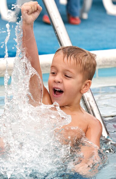 Lukas Wheeler, son of Justin Wheeler with the 1st Special Operations Force Support Squadron, cheers for another kid during swim lessons on Hurlburt Field, Fla., Oct. 3, 2012. Swim lessons are once a week for eight weeks. (U.S. Air Force photo/Airman 1st Class Christopher Williams) 
