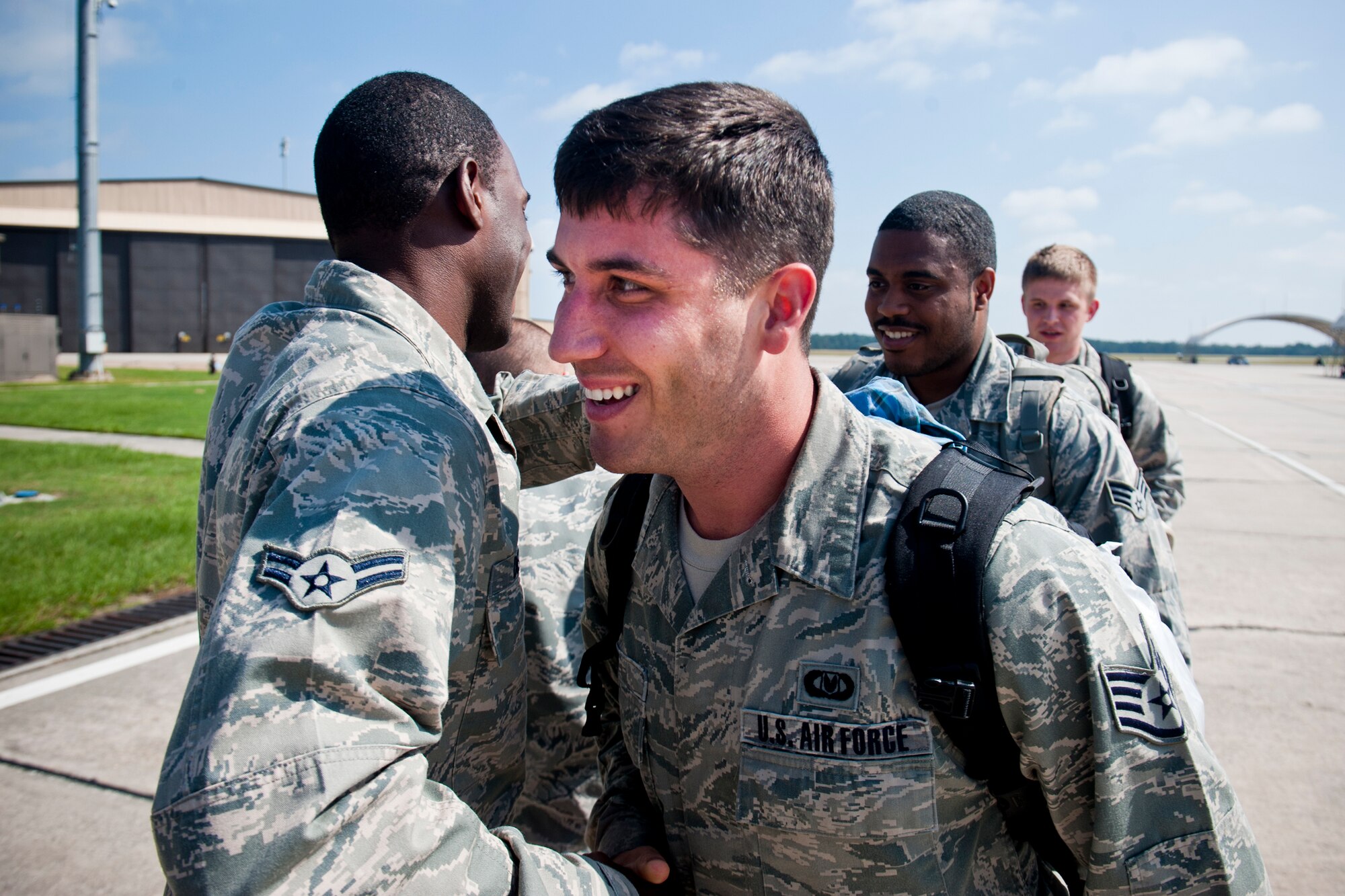 U.S. Air Force Staff Sgt. Kevin Ray, 23d Operations Support Squadron aircrew flight equipment, receives a welcome from Airman 1st Class Dieri Dieujuste, 23d OSS aircrew flight equipment, after returning home to Moody Air Force Base, Ga., Oct. 10, 2012. Ray supported theater security package operations at Osan Air Base, Korea, during a six-month deployment. (U.S. Air Force photo by Staff Sgt. Jamal D. Sutter/Released) 
