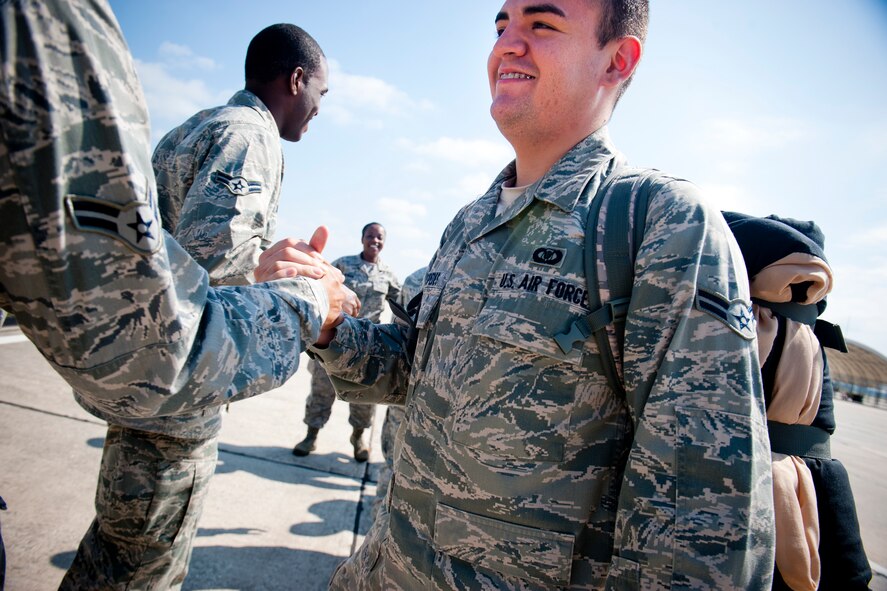 U.S. Air Force Airman 1st Class Julian Cespedes, 75th Fighter Squadron aviation resource management, receives welcomes after returning home to Moody Air Force Base, Ga., Oct. 10, 2012, after a six-month deployment to Osan Air Base, Korea. The deployment was a first for Cespedes. (U.S. Air Force photo by Staff Sgt. Jamal D. Sutter/Released)
