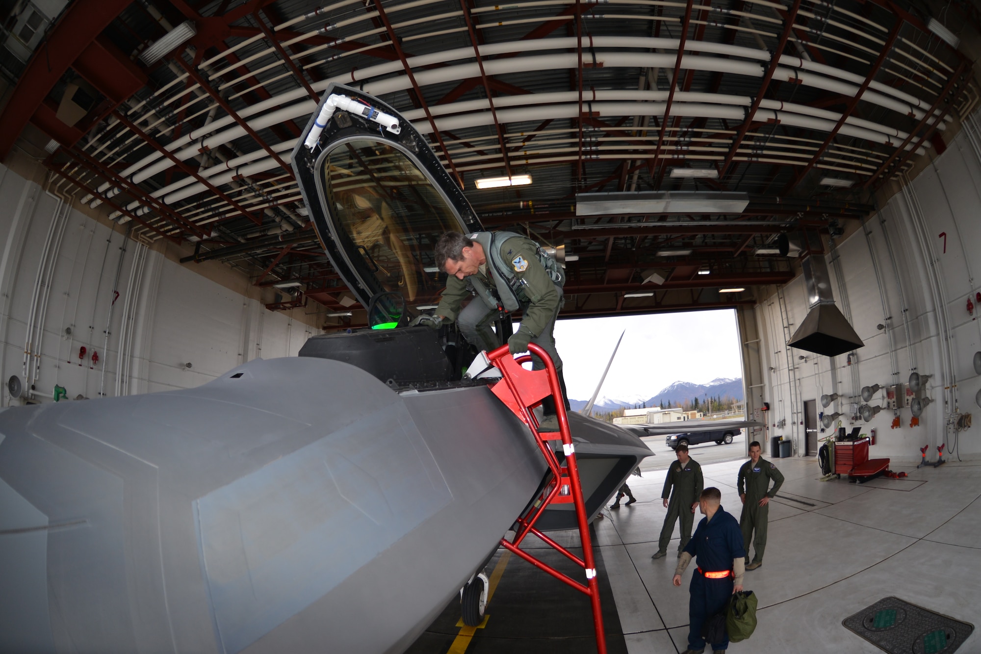 Col. Bryan Radliff, 477th Fighter Group commander, steps out of Aircraft 05-4103. Aircraft 05-4103 along with aircraft 05-4102 returned to Joint Base Elmendorf-Richardson after getting a tune up from the depot facilities at Hill Air Force Base, Utah. (U.S. Air Force Reserve Photo/Tech. Sgt. Dana Rosso)