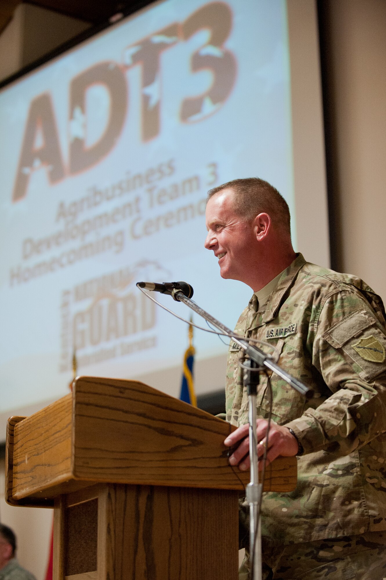 Col. Neil Mullaney, commander of Kentucky Agribusiness Development Team 3, recounts the accomplishments of his 58 Soldiers and Airmen during a homecoming ceremony held Feb. 28, 2012, at the Kentucky Air National Guard Base in Louisville, Ky. The team has been in Afghanistan for the past nine months, helping Afghan farmers develop sustainable agriculture. Its members were instrumental in coordinating the first-ever commercial mulberry harvest in the Panshir Valley, producing 75 metric tons of mulberries and netting $45,000 for local farmers. (U.S. Air Force photo by Maj. Dale Greer)