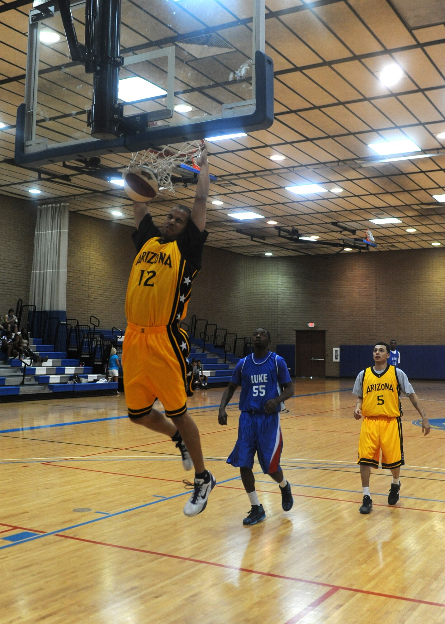 Bryson Krueger, Arizona Scorpions forward, performs a slam dunk during a breakaway drive in a game against the Luke Air Force base team Oct. 06,2012 at the Bryant Fitness Center on Luke AFB, Ariz., Krueger scored 16 points for the game. (U.S. Air Force photo by Airman 1st Class Devante Williams)