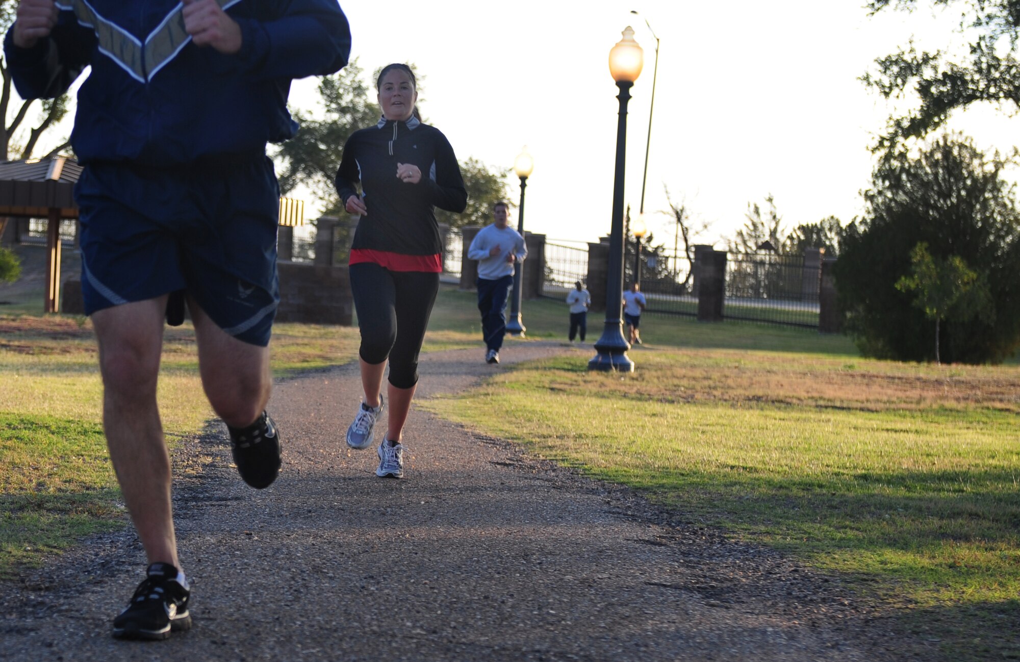 Participants in the Domestic Violence Awareness 5K run/walk finish the course at Cannon Air Force Base, N.M., Oct. 10 2012. October is Domestic Violence Awareness Month and is dedicated toward helping to break the cycle of domestic violence in America. (U.S. Air Force photo/Airman 1st Class Ericka Engblom)

