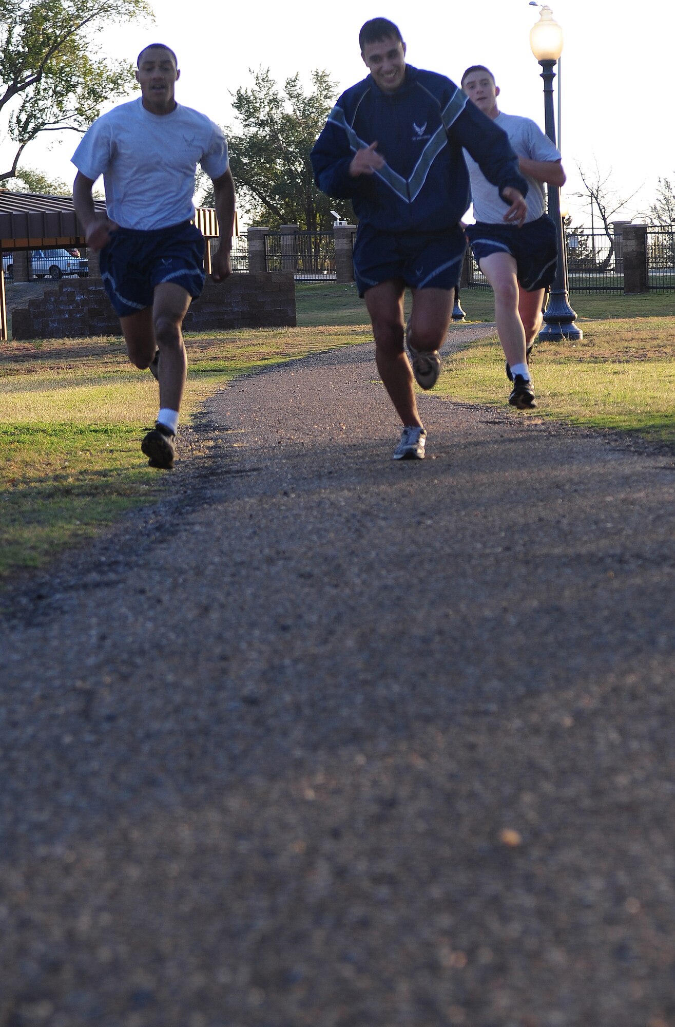 Runners sprint to the finish line during the Domestic Violence Awareness 5K run/walk at Cannon Air Force Base, N.M., Oct. 10 2012. October is Domestic Violence Awareness Month and is dedicated toward helping to break the cycle of domestic violence in America. (U.S. Air Force photo/Airman 1st Class Ericka Engblom)