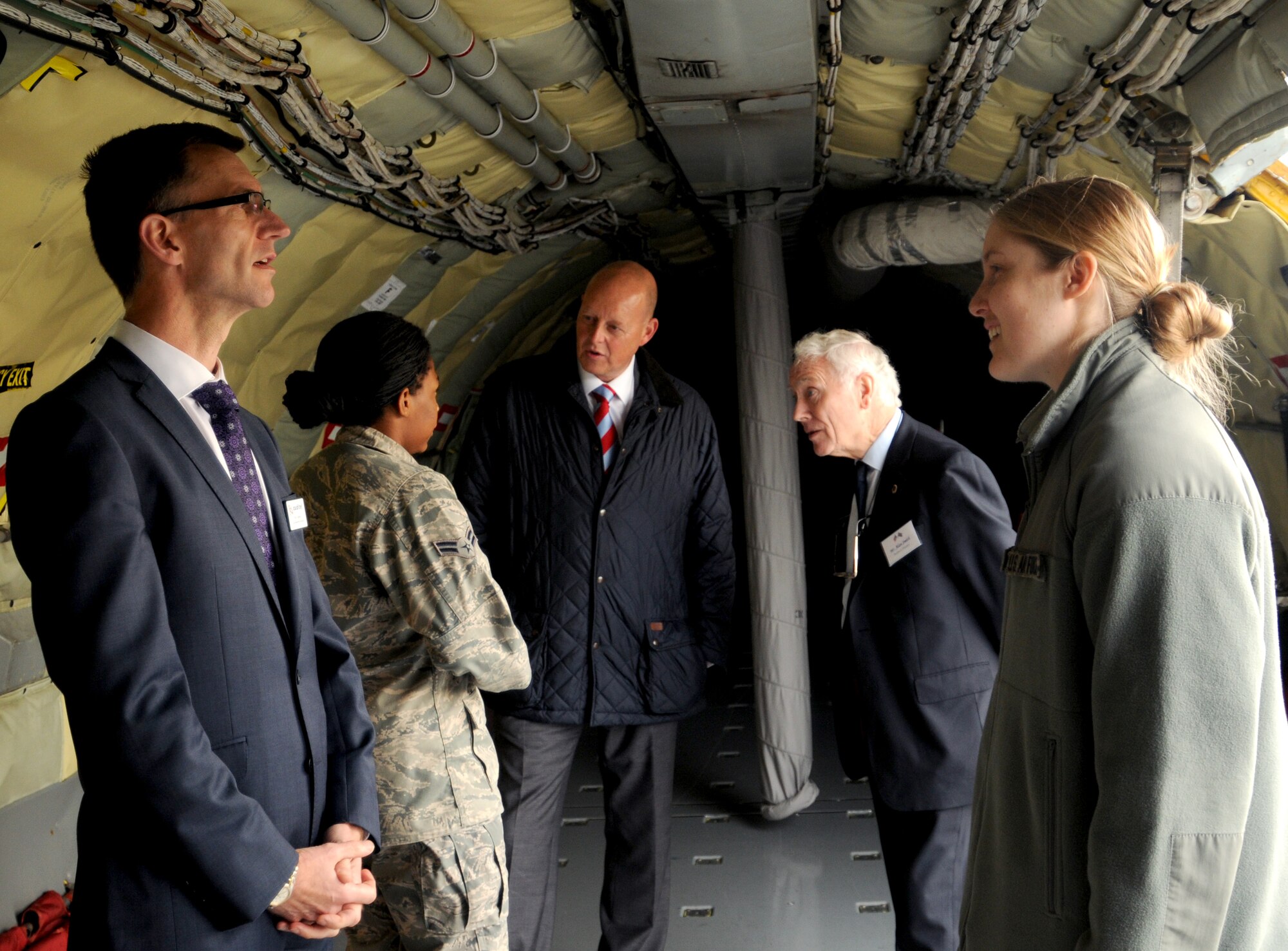 From left, Paul Copsey, Airman 1st Class Kelsey Waters, 100th Air Refueling Wing Public Affairs photojournalist, Paul Millar, Alan Smith, and 1st Lt. Laura Balch, 100th ARW Public Affairs deputy chief, chat inside a KC-135 Stratotanker aircraft during a base tour for members of the Suffolk Chamber of Commerce Oct. 11, 2012, at RAF Mildenhall, England. The tour consisted of breakfast, a mission brief by Col. Christopher Kulas, 100th ARW commander, and the viewing of a KC-135 Stratotanker aircraft. (U.S. Air Force photo by Tech. Sgt. Neal X. Joiner/Released)