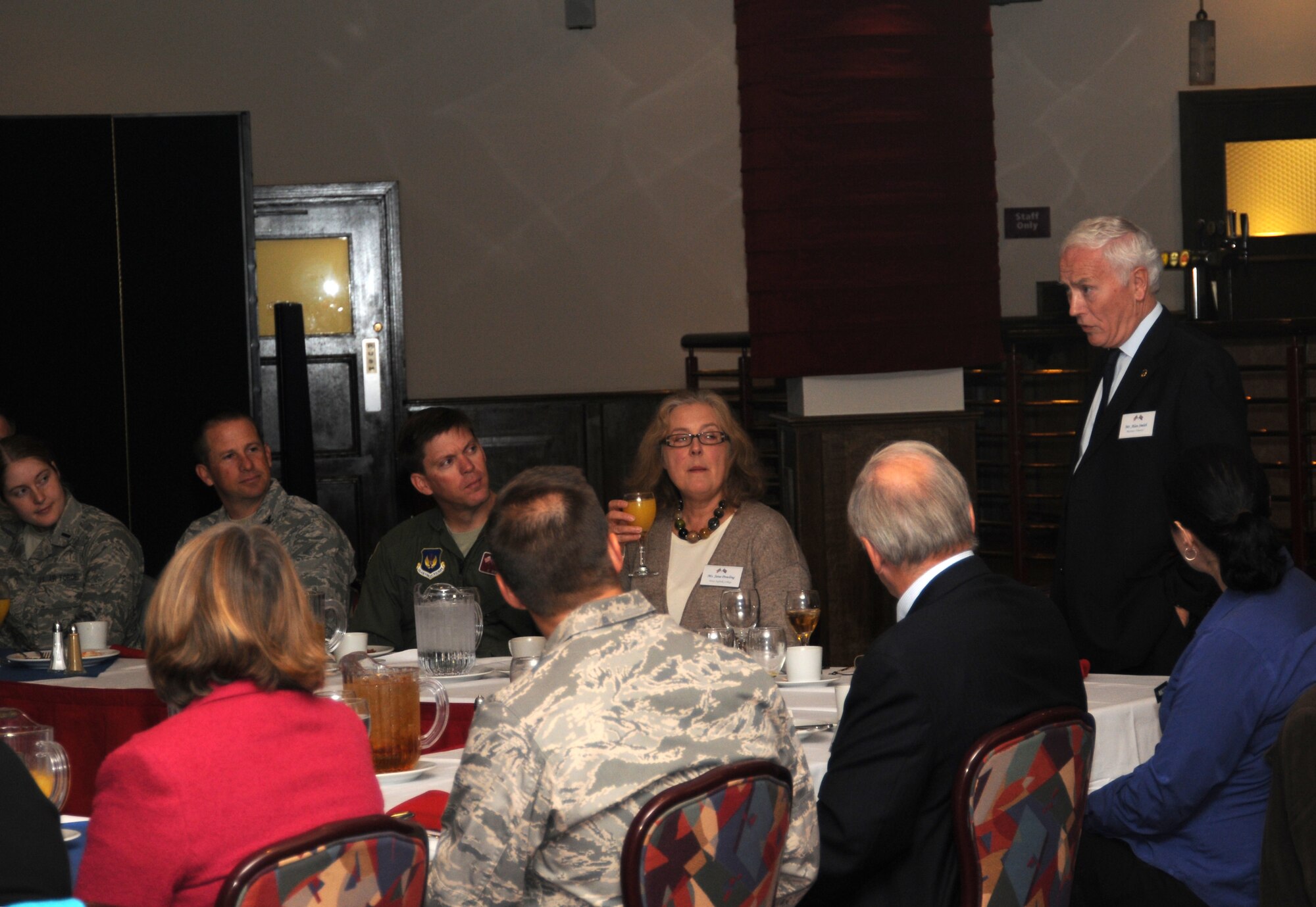 Alan Smith introduces himself to fellow members of the Suffolk Chamber of Commerce and Air Force leaders during breakfast in the Galaxy Club Oct. 11, 2012, at RAF Mildenhall, England. Smith and other members of the chamber were at the base for a tour of a KC-135 Stratotanker aircraft and to bolster relations between the local community and the base.  (U.S. Air Force photo by Tech. Sgt. Neal X. Joiner/Released) 