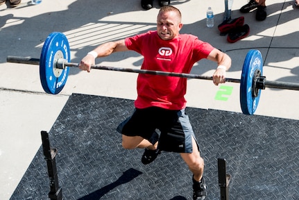 Chief Master Sgt. John Storms, 628th Security Forces Squadron superintendent, performs a power clean with weights at Intregrity’s Revenge CrossFit competition Oct. 6, 2012, at the Charleston Maritime Center, Charleston, S.C. Joint Base Charleston had several members participate in the event. (U.S. Air Force photo/ Staff Sgt. Rasheen Douglas)