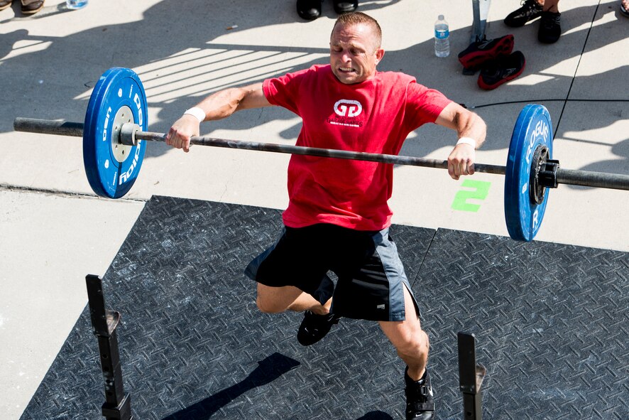 Chief Master Sgt. John Storms, 628th Security Forces Squadron superintendent, performs a power clean with weights at Intregrity’s Revenge CrossFit competition Oct. 6, 2012, at the Charleston Maritime Center, Charleston, S.C. Joint Base Charleston had several members participate in the event. (U.S. Air Force photo/Staff Sgt. Rasheen Douglas) 


