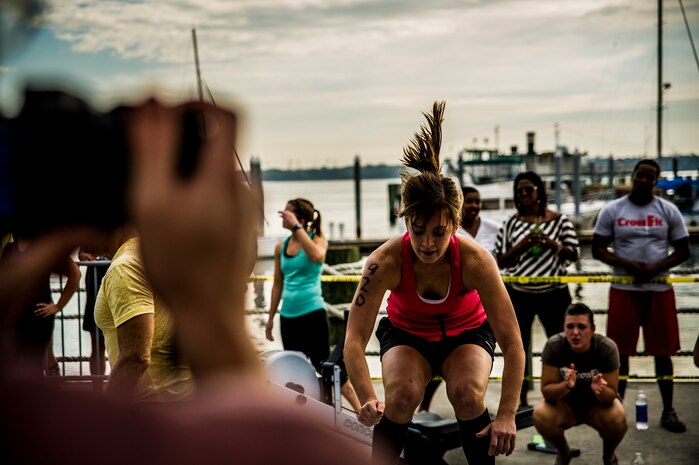 Kristin Woods, spouse of Senior Airman Nick Woods, 437th Aerial Port Squadron traffic management office, performs box jumps Oct. 6, 2012, during Integrity’s Revenge at the Charleston Maritime Center, Charleston, S.C.  Joint Base Charleston had several members participate in the CrossFit event, which included box jumps, rowing, power clean with weights and rings. (U.S. Air Force photo/ Senior Airman Dennis Sloan)