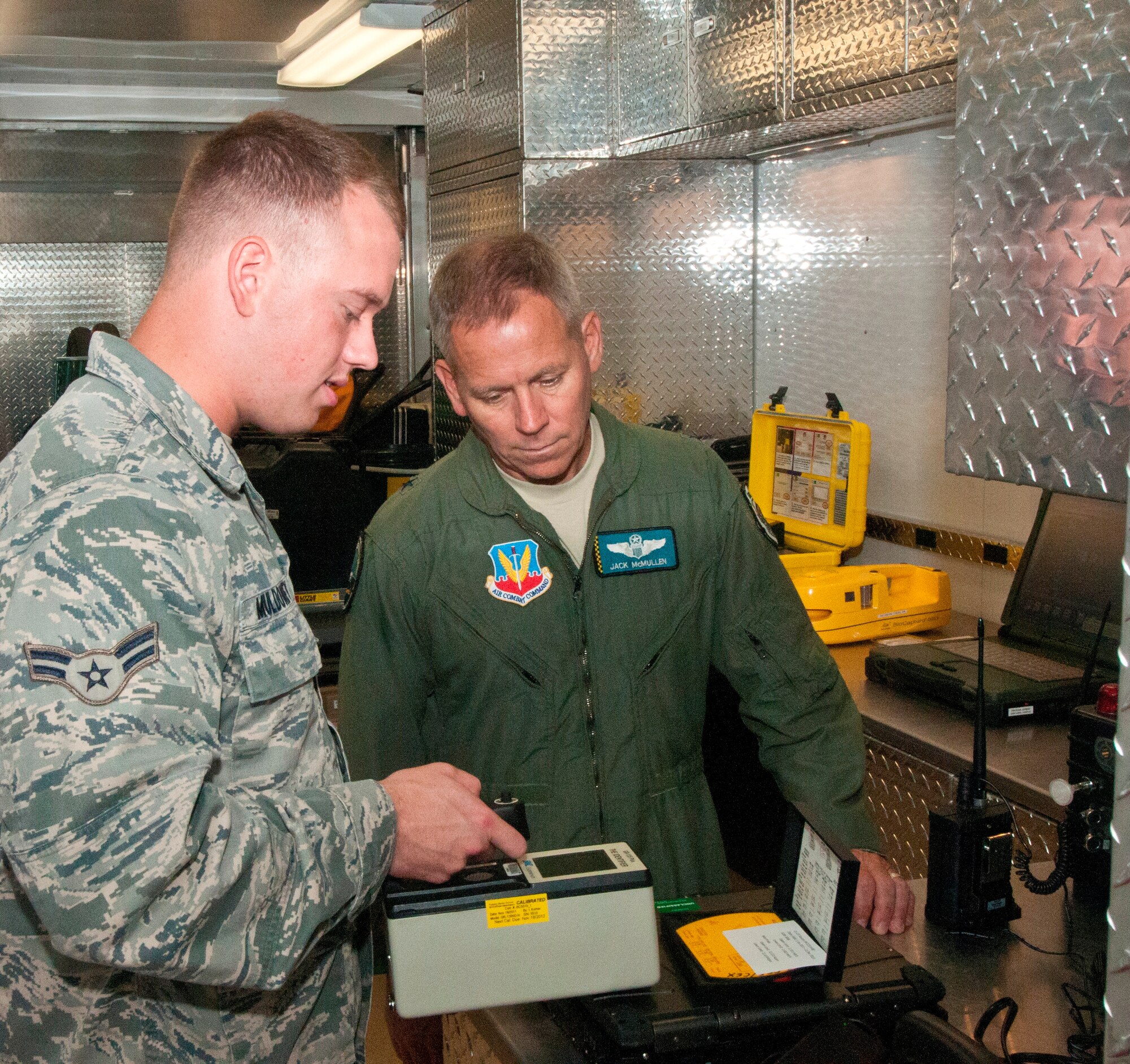 Airman 1st Class Daniel Muldowney, 325th Civil Engineer Squadron emergency management training apprentice, showed Brig. Gen. John McMullen, 325th Fighter Wing commander, his duties as an emergency management training apprentice for the Airman Shadow Program, Oct. 5. (U.S. Air Force photo by Christopher Cokeing)