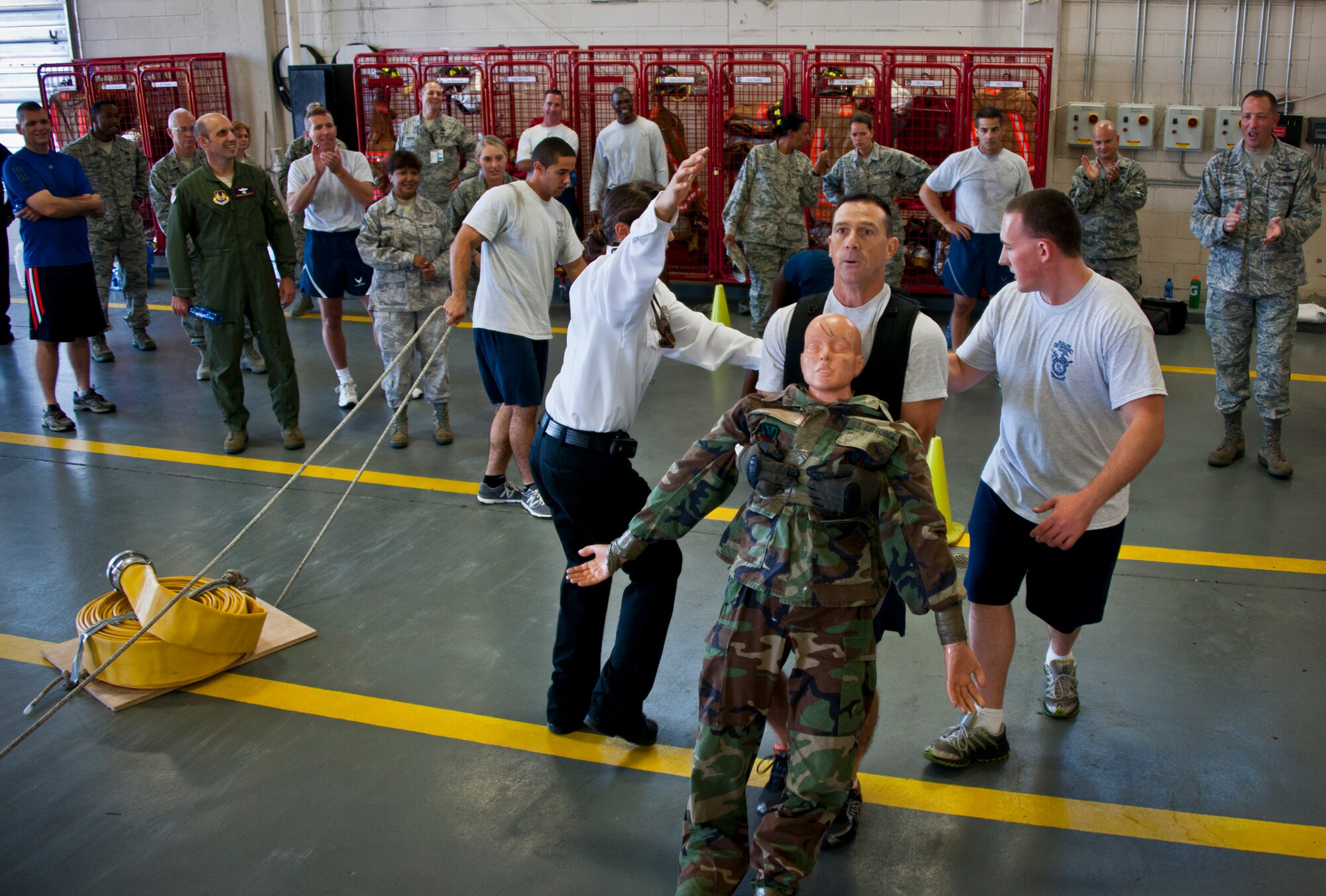 Chief Master Sgt. Chris Wilbur, of the 33rd Maintenance Group, pulls a 120-pound dummy across the finish line to complete the Chiefs versus Eagles Fire Prevention Week Challenge Oct. 9 at Eglin Air Force Base, Fla.  Colonels and chief master sergeants raced through a series of firefighting physical activities to see who could finish first.  The challenges included hose dragging, ladder climbing, victim carry and more.  Four colonels and seven chiefs competed and their scores were averaged to determine the winner.  The Eagles won by 12 seconds, but the chiefs quickly pointed out that had they chosen to only have four competitors, they’d have taken the victory by a second.  (U.S. Air Force photo/Samuel King Jr.)