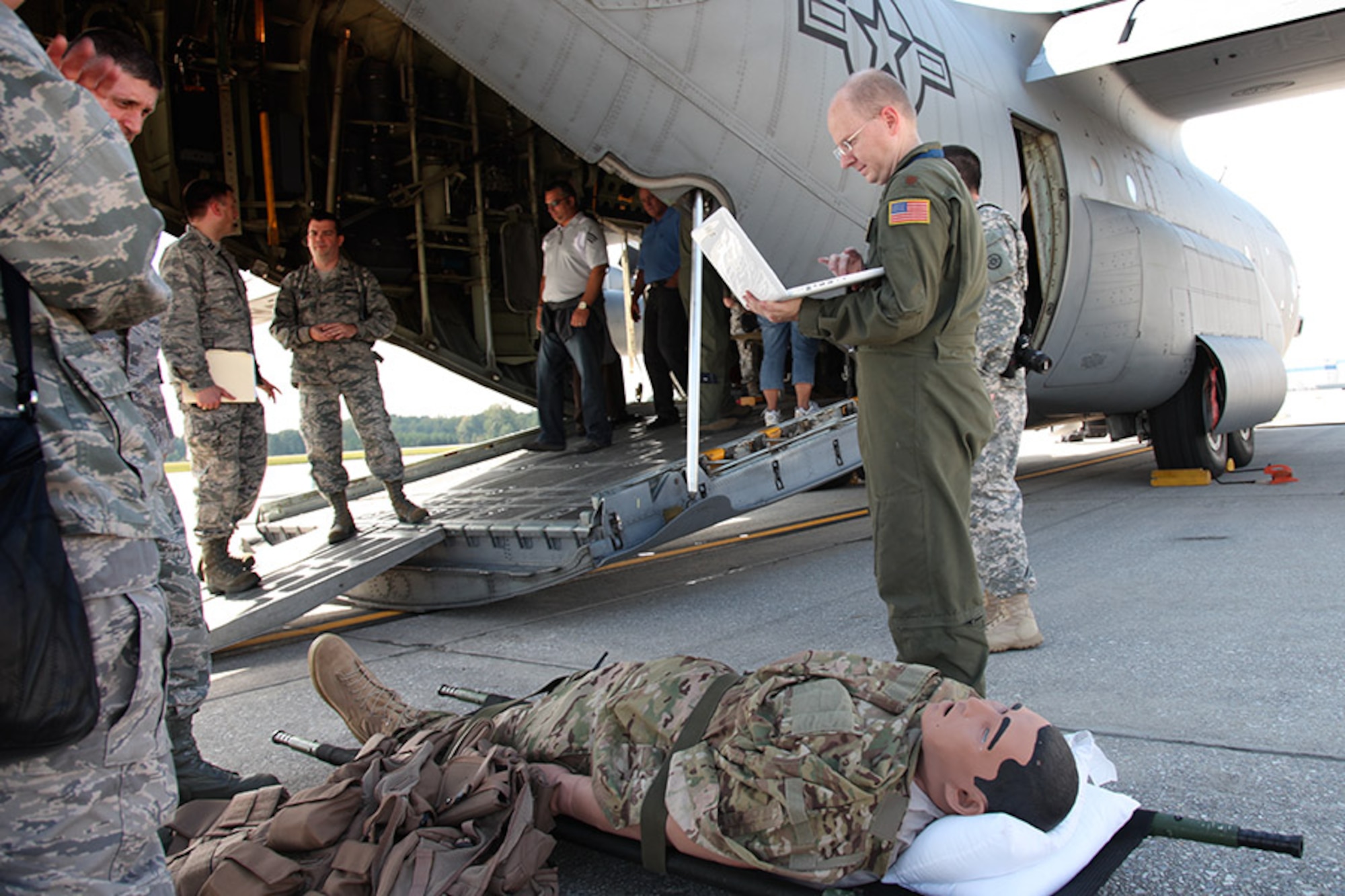 Major Chad Corliss, Director of Operations for the 94th Airlift Wing Aeromedical Evacuation Squadron, demonstrates the iStan patient simulator to the Pittsburgh civic leaders during their two-day tour at Dobbins Air Reserve Base, Ga, Oct. 3, 2012. The wireless iStan fully simulates patient movement, has fully reactive pupils and blinking eyes, convulsions and ultra-realistic bleeding and secretions which makes it the perfect trainer for emergency medicine. (U.S. Air Force photo by tech. Sgt. Ralph Van Houtem/Released)
