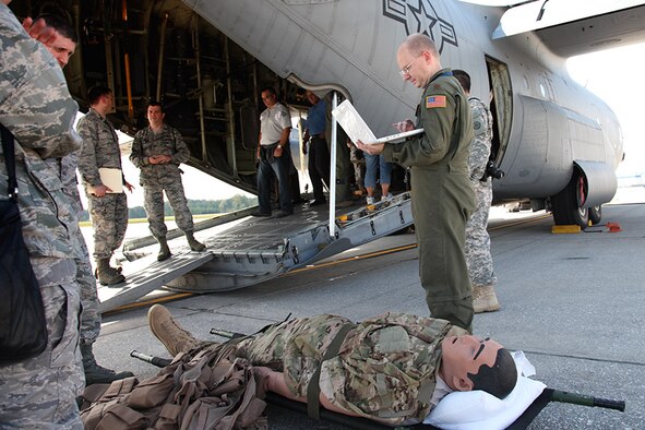 Major Chad Corliss, Director of Operations for the 94th Airlift Wing Aeromedical Evacuation Squadron, demonstrates the iStan patient simulator to the Pittsburgh civic leaders during their two-day tour at Dobbins Air Reserve Base, Ga, Oct. 3, 2012. The wireless iStan fully simulates patient movement, has fully reactive pupils and blinking eyes, convulsions and ultra-realistic bleeding and secretions which makes it the perfect trainer for emergency medicine. (U.S. Air Force photo by tech. Sgt. Ralph Van Houtem/Released)
