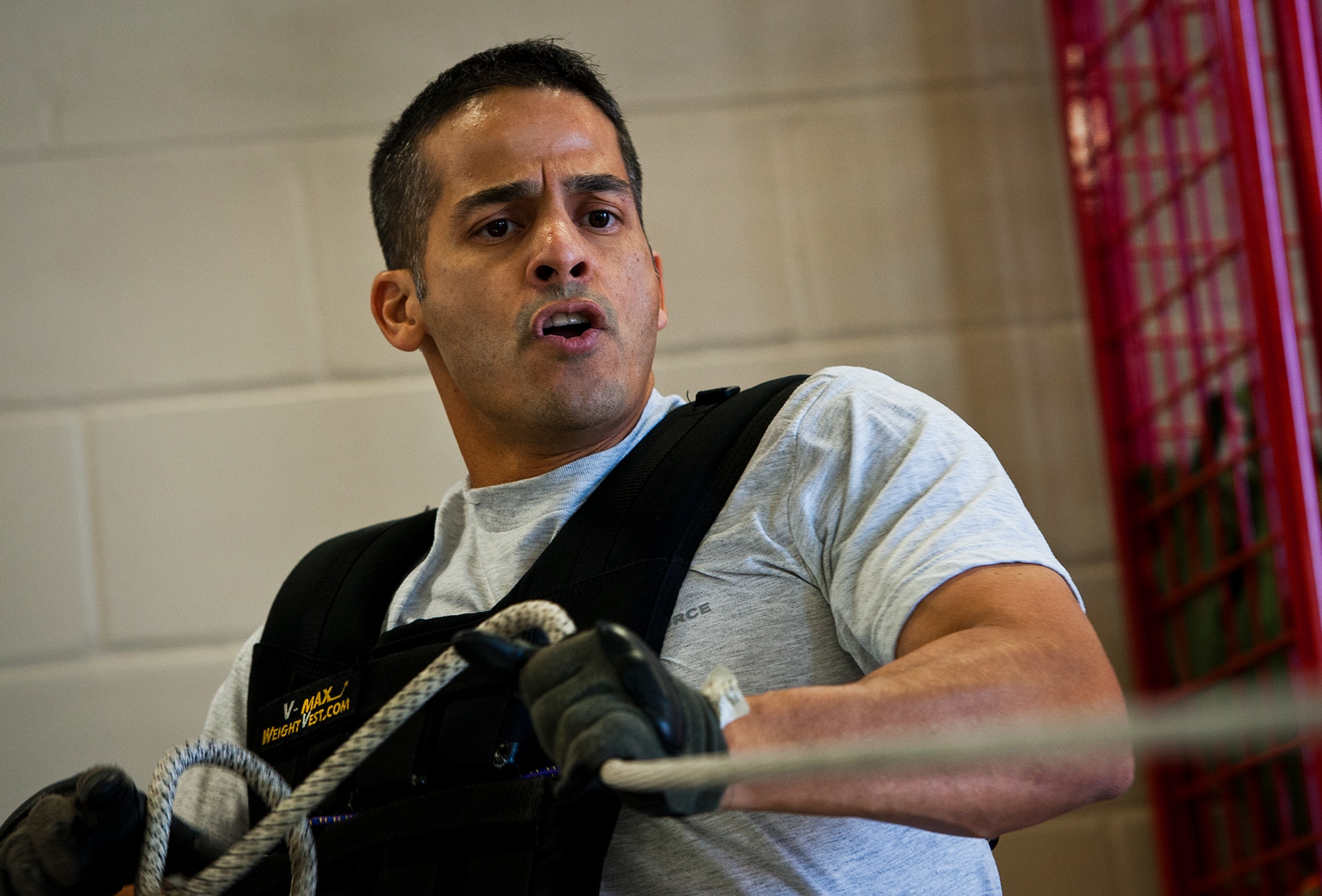 Chief Master Sgt. Ben Caro, the 96th Test Wing command chief, pulls a water hose sled across the length of the firehouse as part of the Chiefs versus Eagles Fire Prevention Week Challenge Oct. 9 at Eglin Air Force Base, Fla.  Colonels and chief master sergeants raced through a series of firefighting physical activities to see who could finish first.  The challenges included hose dragging, ladder climbing, victim carry and more.  Four colonels and seven chiefs competed and their scores were averaged to determine the winner.  The Eagles won by 12 seconds, but the chiefs quickly pointed out that had they chosen to only have four competitors, they’d have taken the victory by a second.  (U.S. Air Force photo/Samuel King Jr.)