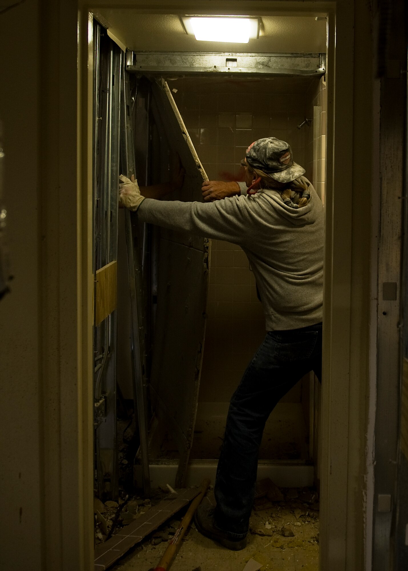 Martinez Lionel, contractor, tears down a wall in the Parish Hall dormitory Oct. 10, 2012, during a renovation project at Dyess Air Force Base, Texas. The $8 million project recently began for Parish and Andrews Hall, which upgrades 128 rooms, making them 33 percent larger, with washers and dryers. The renovation is scheduled to be complete near the end of 2013. (U.S. Air Force photo by Airman 1st Class Damon Kasberg/ Released)