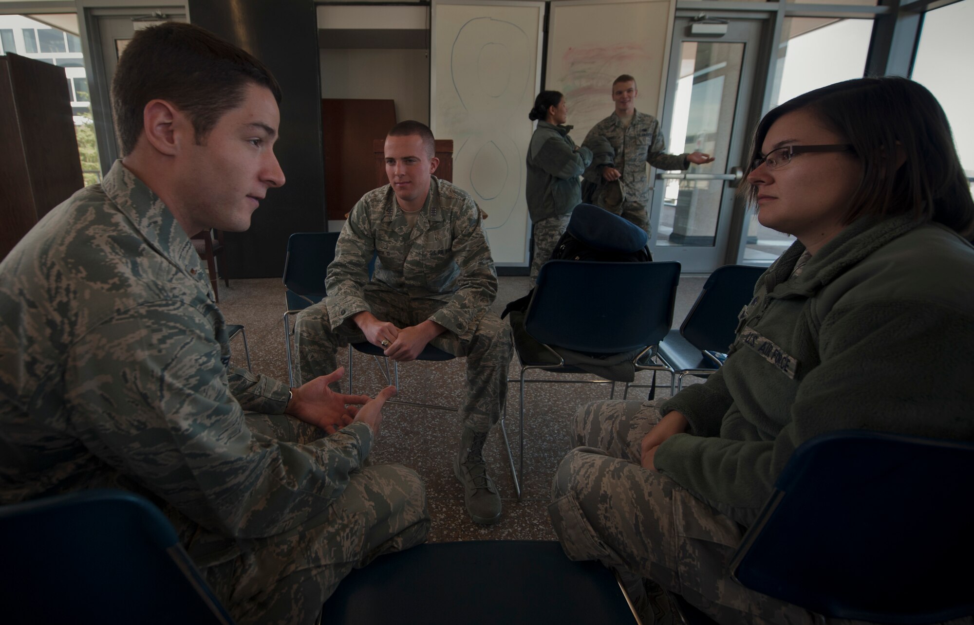 Second Lt. Daniel Venable (left), 23d Operations Support Squadron airfield operations officer, discusses the operational Air Force with cadets as part of a mentorship trip at the U.S. Air Force Academy, Colo., on Oct. 4, 2012. Venable was one of a few mentors who spoke with the cadets during the trip to the Academy. (U.S. Air Force photo by Senior Airman Nicholas Benroth/Released)