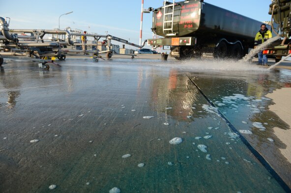 SPANGDAHLEM AIR BASE, Germany – Simulated JP-8 fuel spills from a fuel truck on the flightline Oct. 10, 2012. The Defense Logistics Agency mandates that Air Force installations conduct an annual exercise to test their emergency procedures when responding to a fuel spill. (U.S. Air Force photo by Staff Sgt. Nathanael Callon/Released)