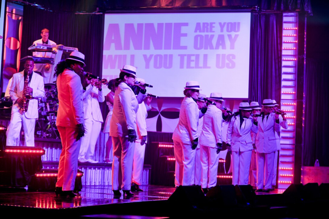 RAF FAIRFORD, United Kingdom – Members of the Tops In Blue 2012 World Tour perform Michael Jackson’s “Smooth Criminal” in Hangar 1205 at RAF Fairford Oct. 5. The group sang and danced for an audience of nearly 900 members of the local community. (U.S. Air Force photo by Staff Sgt. Brian Stives)