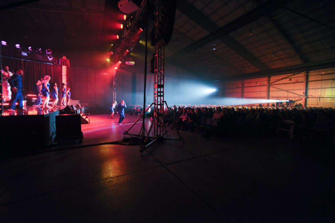 RAF FAIRFORD, United Kingdom - The Tops In Blue 2012 World Tour, “Listen,” perform in Hangar 1205 at RAF Fairford Oct. 5. The group sang and danced for an audience of nearly 900 members of the local community. (U.S. Air Force photo by Staff Sgt. Brian Stives)