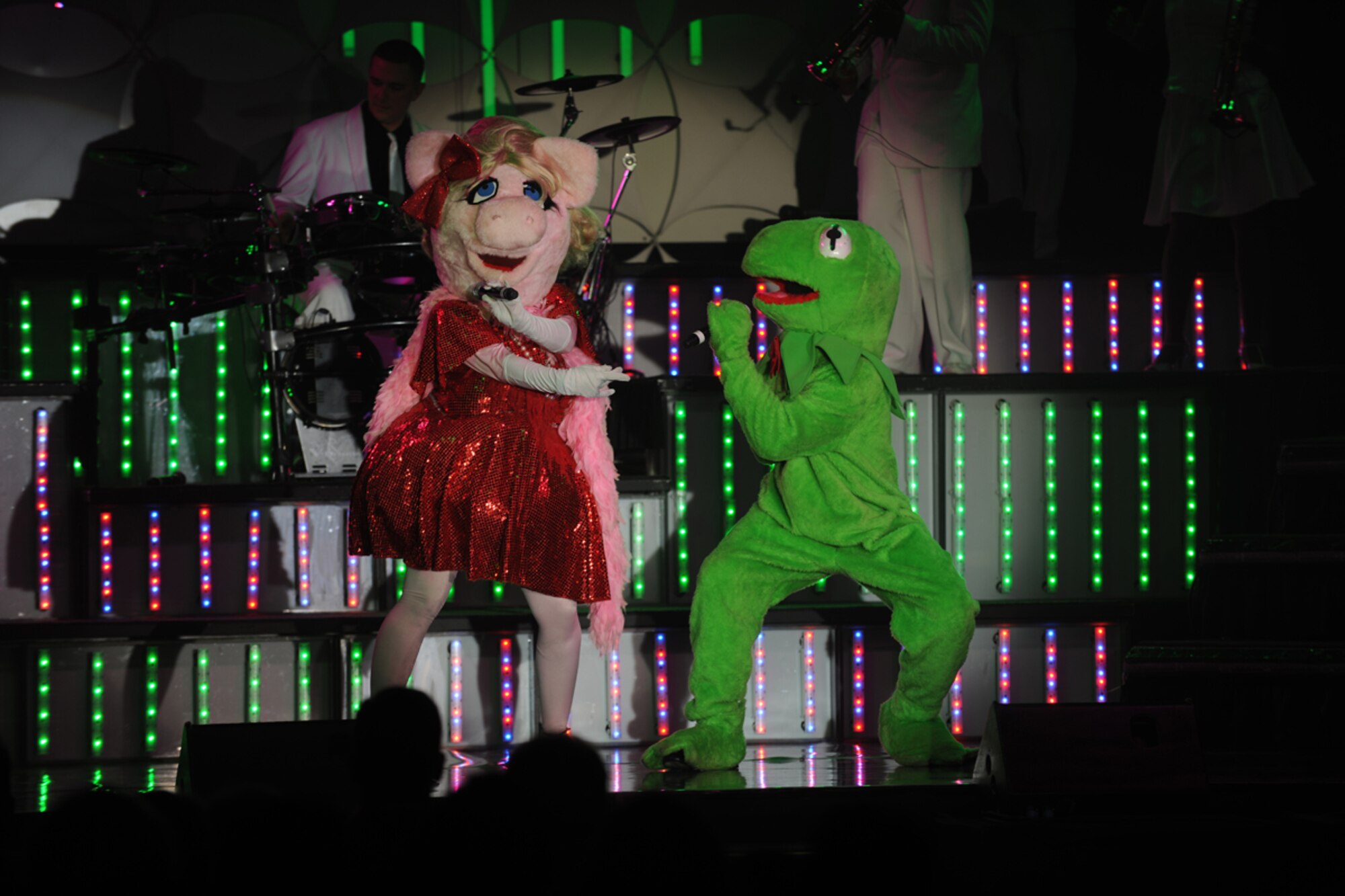 RAF CROUGHTON, United Kingdom – Ms. Piggy and Kermit the Frog perform the song, “Love is Strange,” during the Tops In Blue 2012 World Tour, “Listen,” at the RAF Croughton Fitness Center Oct. 4. Tops In Blue sang and danced for an audience of nearly 260 members of the 422nd Air Base Group and local community. (U.S. Air Force photo by Master Sgt. John Barton)