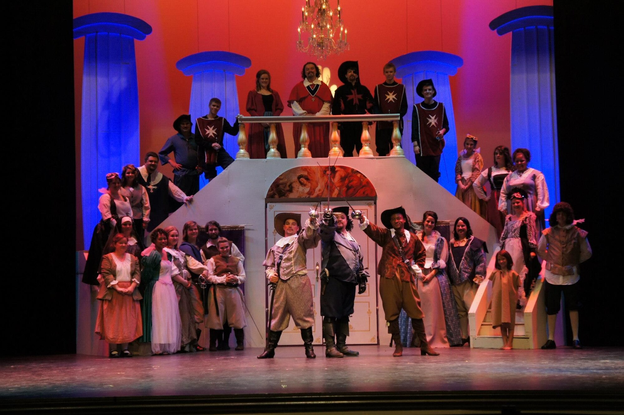 Members of the acting company Center Stage Theater pose after a performance of the “Three Musketeers” at the Paramount Theater in Goldsboro, N.C., in August 2012. U.S. Air Force Master Sgt. Daniel Ruffino, 4th Fighter Wing NCO in charge of wing plans, and Senior Airman Erica Winfield, 4th Maintenance Operations Squadron supply Airman, both participated in this play and share a love of acting. (Courtesy photo)